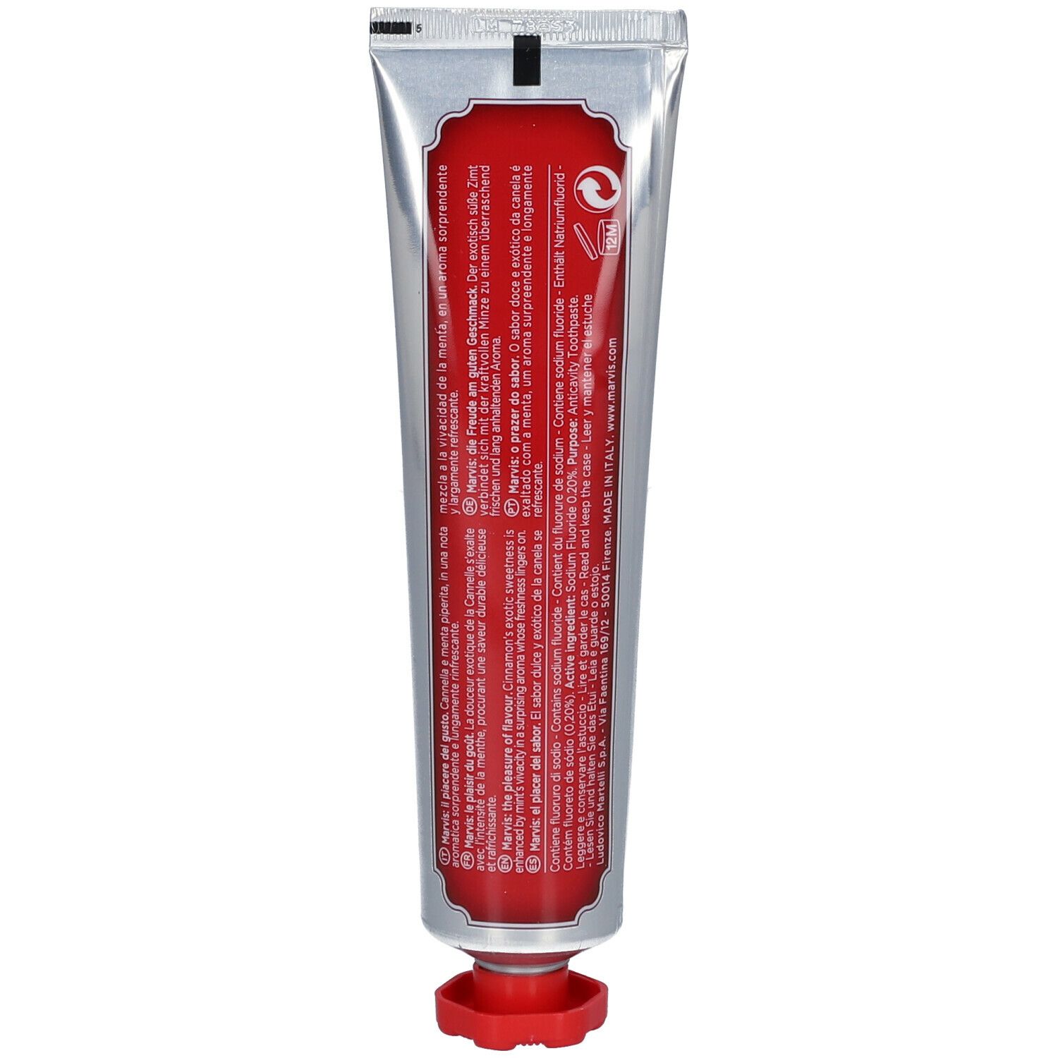 Rückseite der Zahncreme-Tube. Rotes Etikett mit Text in verschiedenen Sprachen.