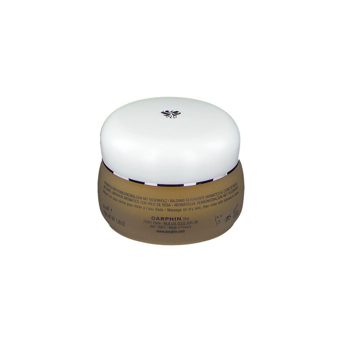 Pot rond avec couvercle blanc. Inscription: DARPHIN PARIS, BAUME NETTOYANT AROMATIQUE AU BOIS DE ROSE, AROMATIC CLEANSING BALM WITH ROSEWOOD. Texte multilingue.