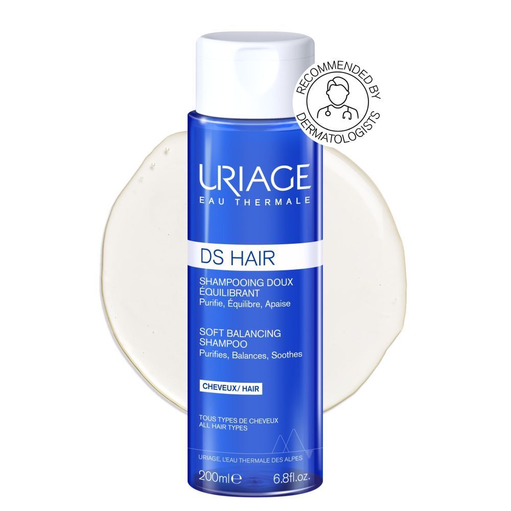 Uriage DS Hair Shampoo, blauwe fles met witte dop. Tekst: DS Hair, Shampooing Doux Équilibrant, Soft Balancing Shampoo.