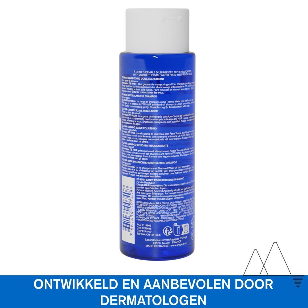 Achterkant van de Uriage DS Hair shampoo fles. Blauwe fles met witte dop. Tekst.
