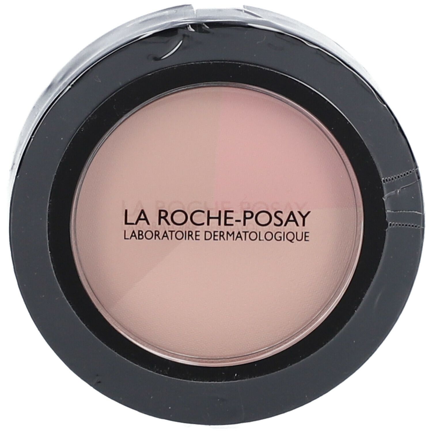 Boîtier rond noir avec poudre rose. Inscription : LA ROCHE-POSAY.