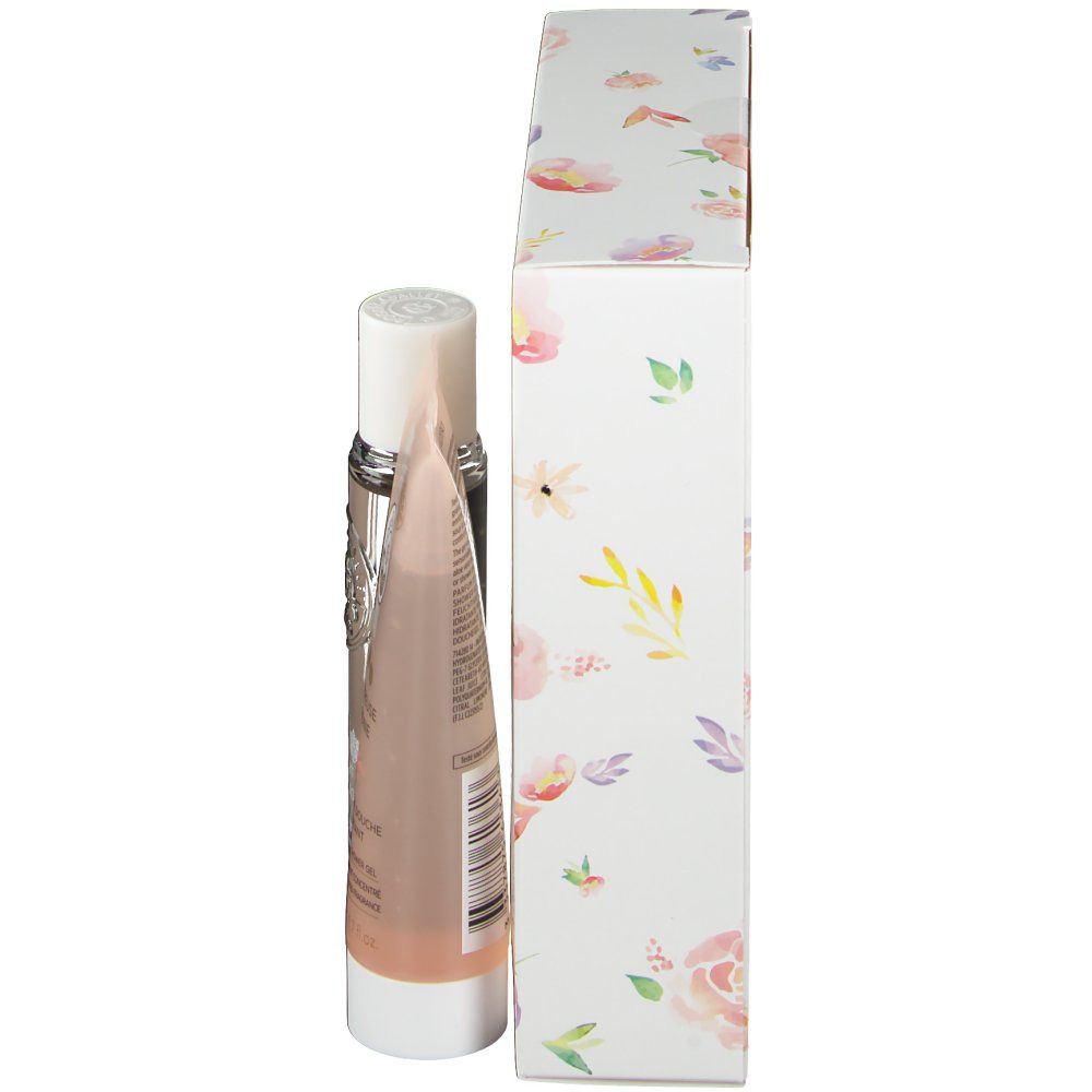 Cadeauset met fles en tube. Verpakking met bloemmotief. Zijkant van de verpakking en producten.
