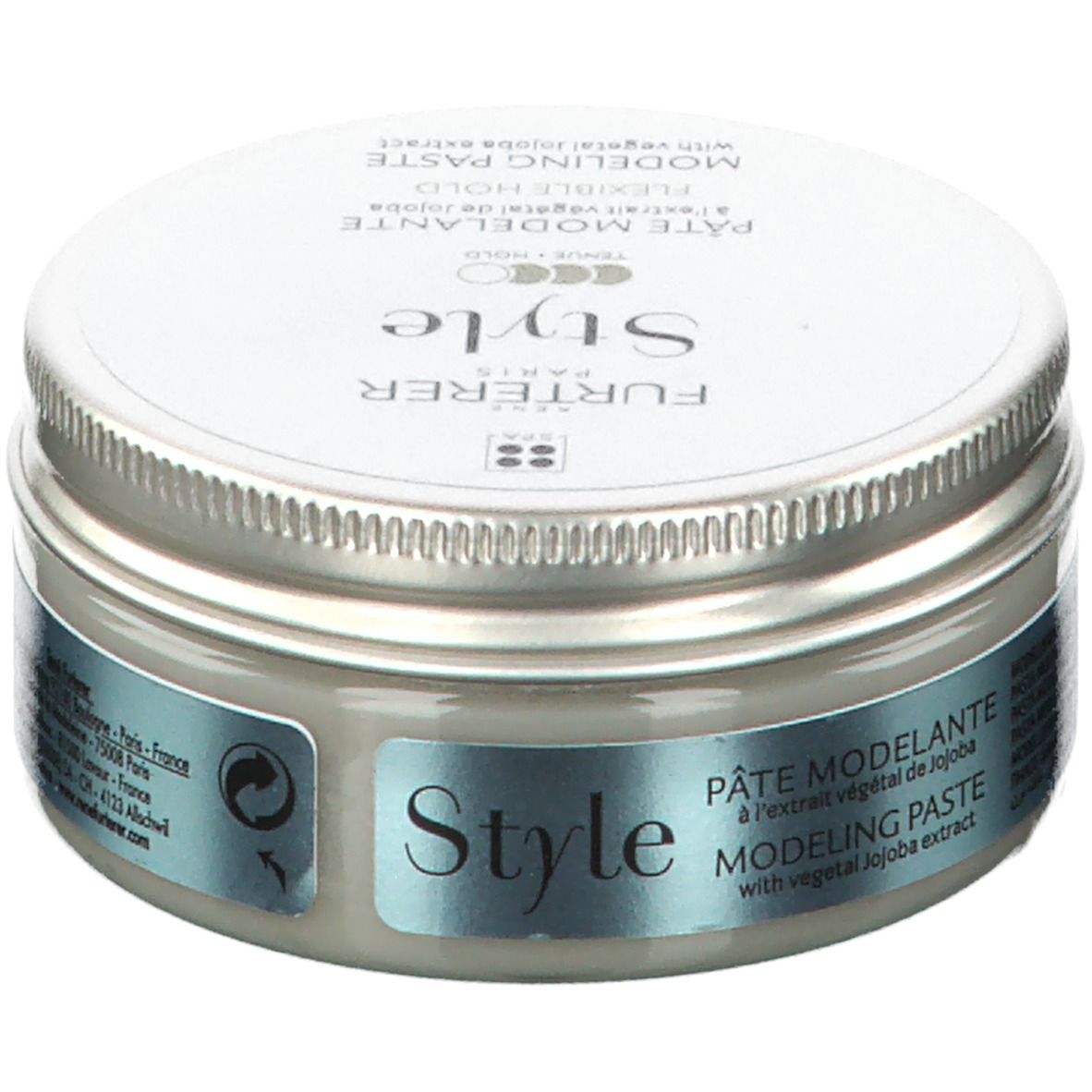 Ronde pot met zilveren deksel. Opschrift: FURTERER Style. Bevat modelleerpasta met jojoba-extract. Productnaam in het Duits.