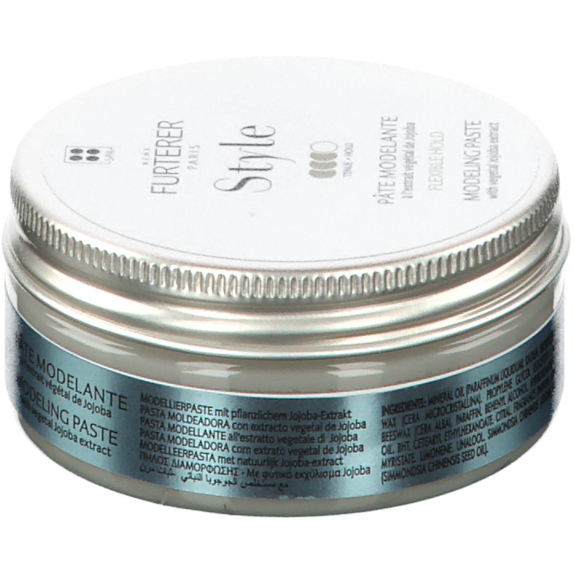 Ronde pot met zilveren deksel. Opschrift: FURTERER Style. Bevat modelleerpasta met jojoba-extract. Meertalige productnamen.