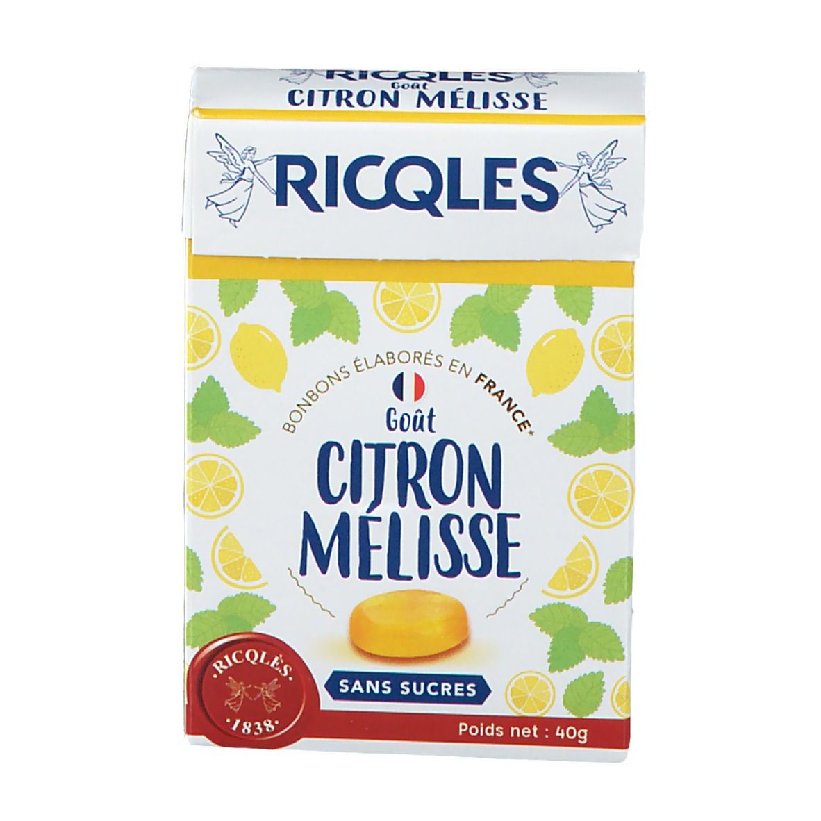 Vue de face de la boîte de bonbons. Inscription: RICQLES, Gout Citron Mélisse, Sans Sucres. Citrons et menthe.
