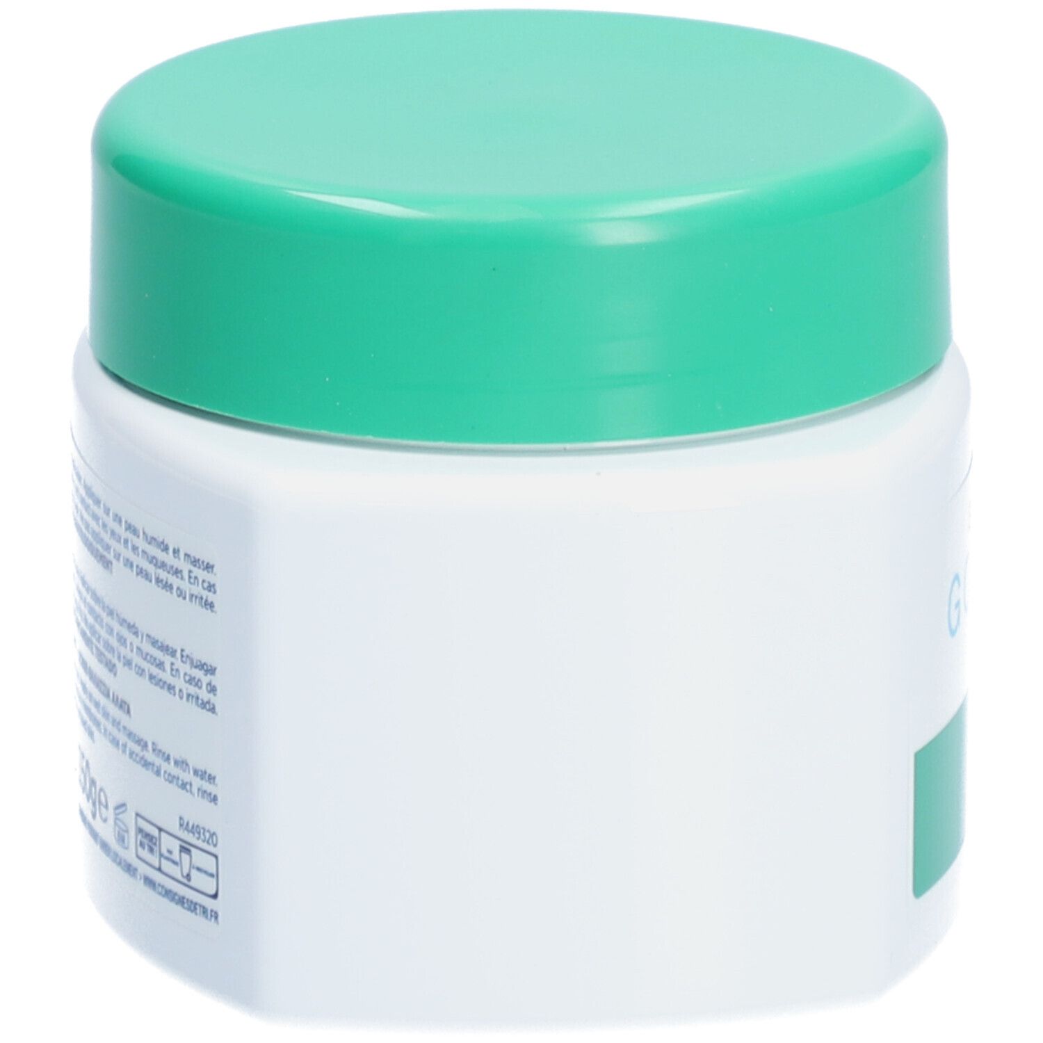 Weißes Tiegel mit grünem Deckel. Seitenansicht. Keine weitere Beschriftung sichtbar.