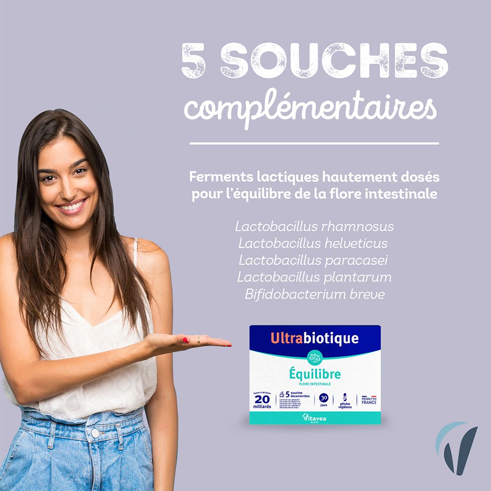 Vrouw presenteert verpakking Ultrabiotique Équilibre. Opschrift: 20 miljard, 5 stammen. Tekst: Ferments lactiques pour l'équilibre de la flore intestinale.