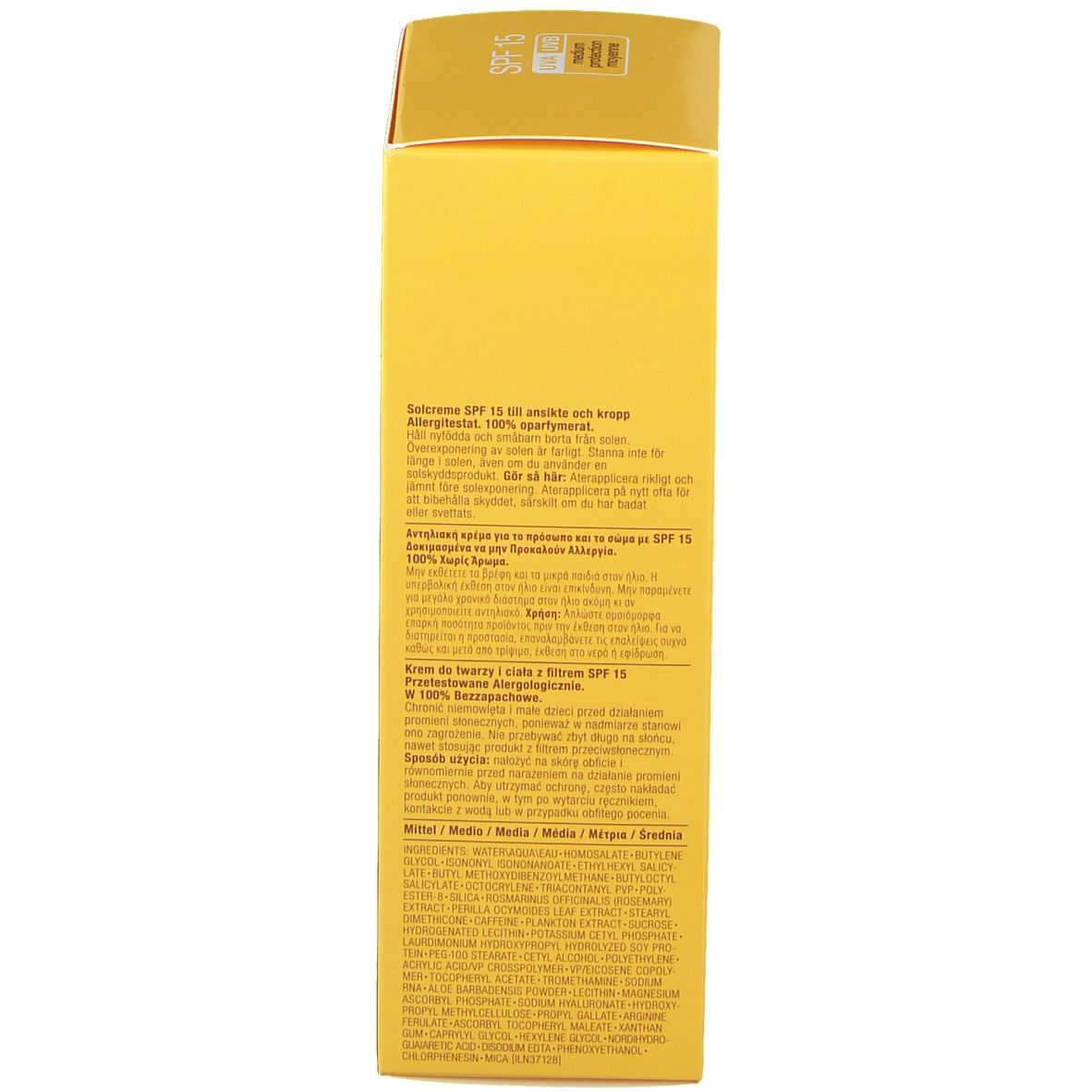 Boîte jaune avec texte. Dos avec informations multilingues. Inscription : SPF 15.