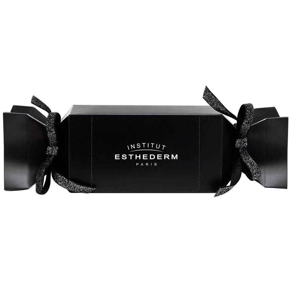 Schwarze Geschenkbox in Cracker-Form mit Schleifen. Aufschrift: INSTITUT ESTHEDERM PARIS.