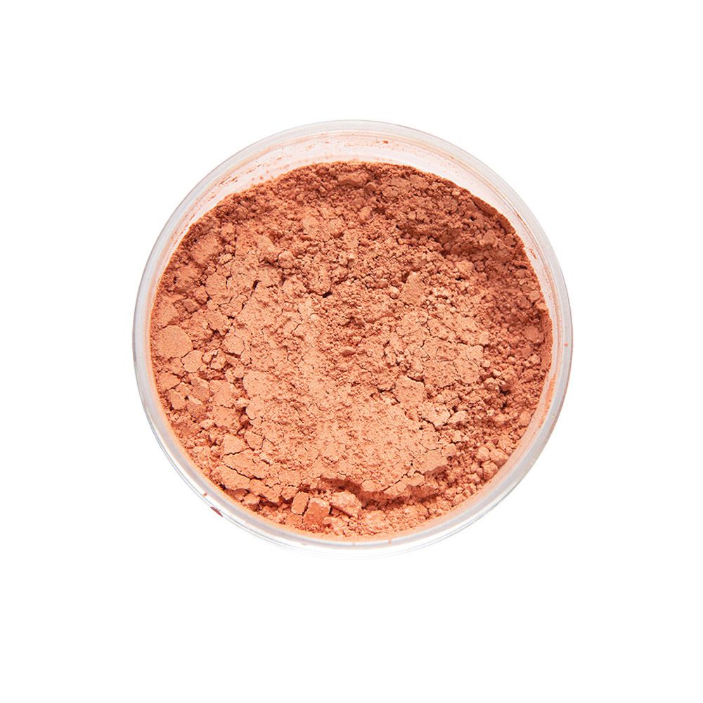 Récipient rond avec contenu rose. Le récipient est ouvert.