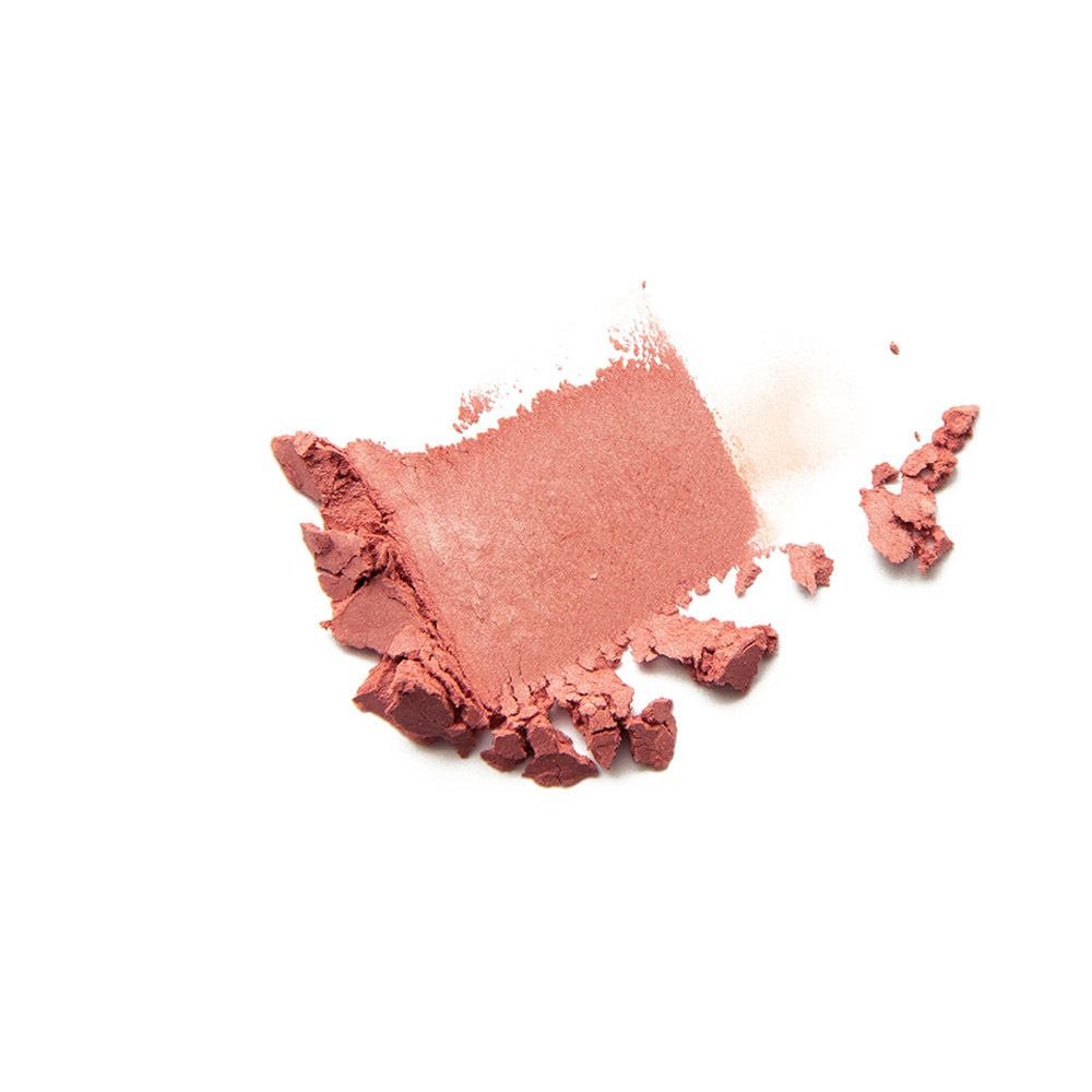 Poudre rose sur fond blanc. Une trace de poudre rose.