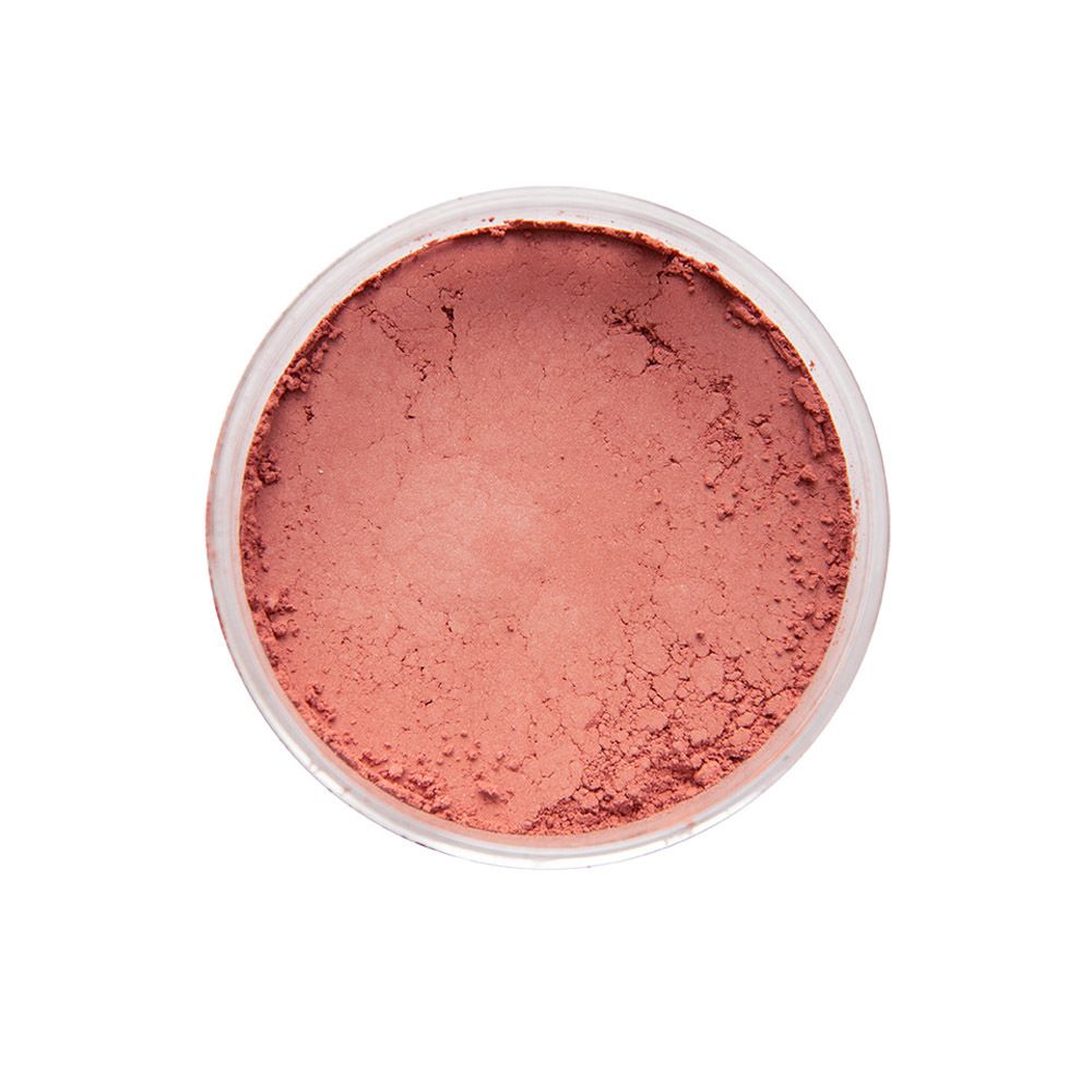 Poudre rose dans un récipient transparent. Vue de dessus.