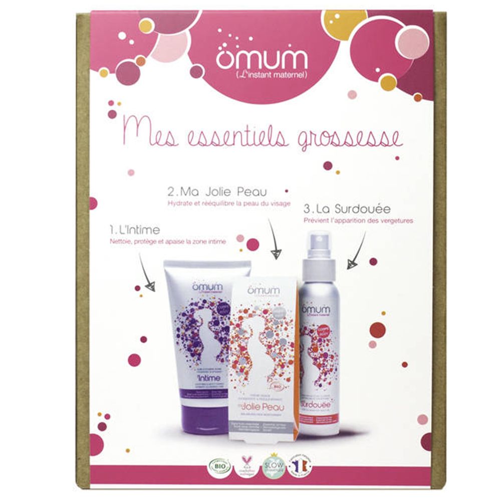 Emballage de produits ömum. Contient crème, nettoyant intime et spray corporel. Texte: Mes essentiels grossesse.