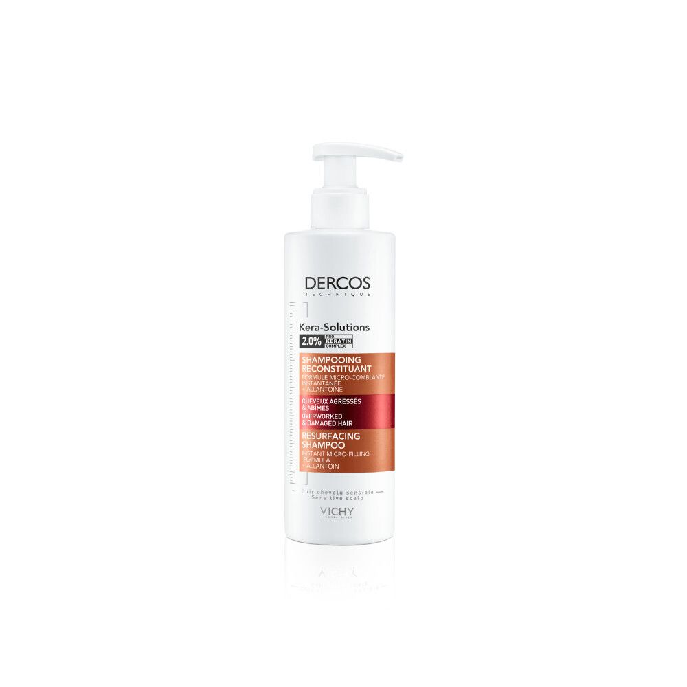 Witte shampoo fles met pomp. Opschrift: Dercos Kera-Solutions, Shampoo. Voor beschadigd haar.