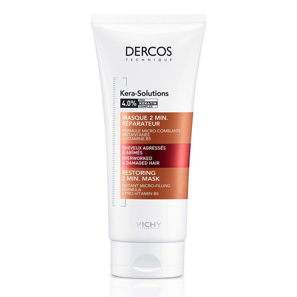 Tube blanc. Inscriptions: Dercos, Kera-Solutions, Masque 2 min. réparateur. Accents marron et rouge.