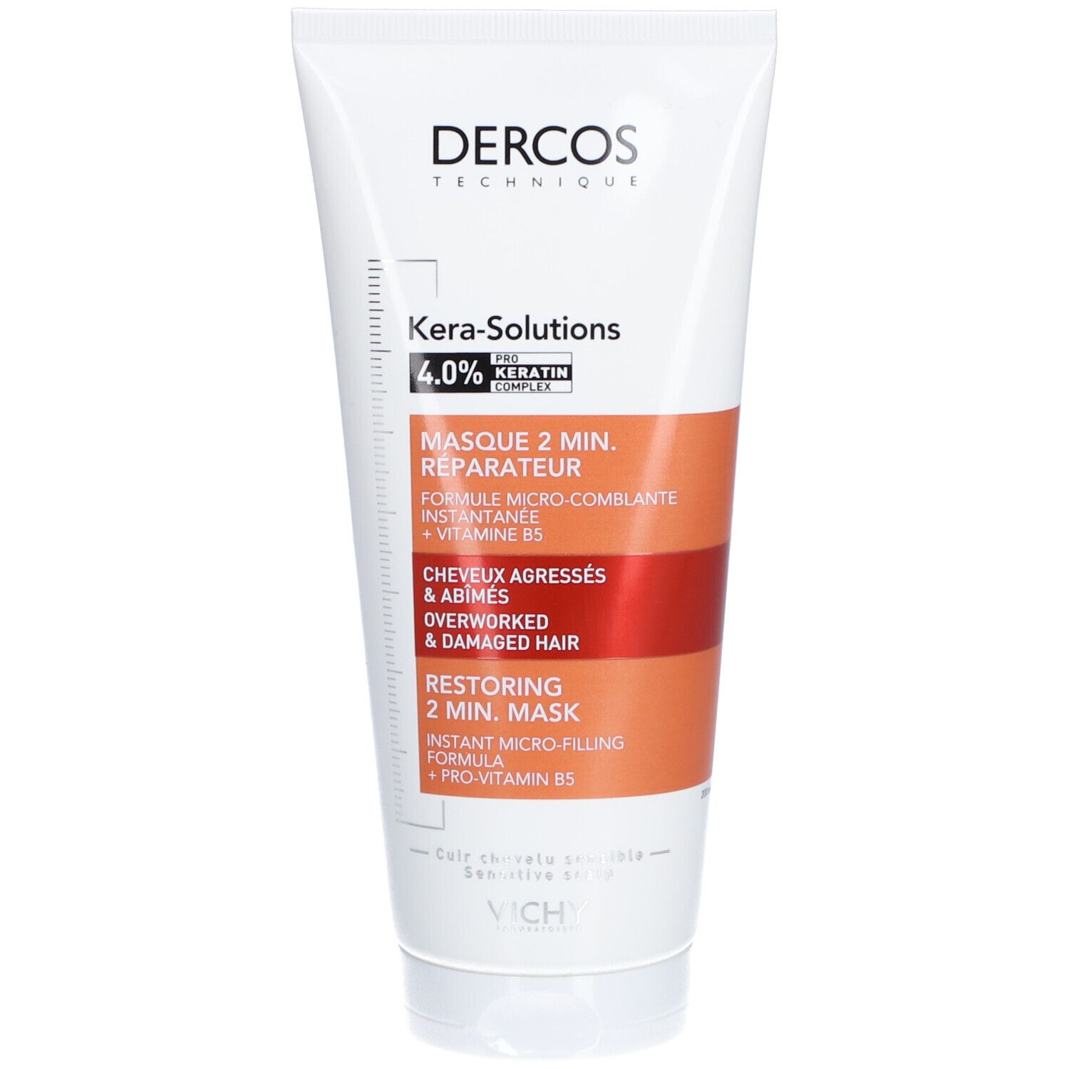 Tube blanc. Inscriptions: Dercos, Kera-Solutions, Masque 2 min. réparateur. Accents marron et rouge.