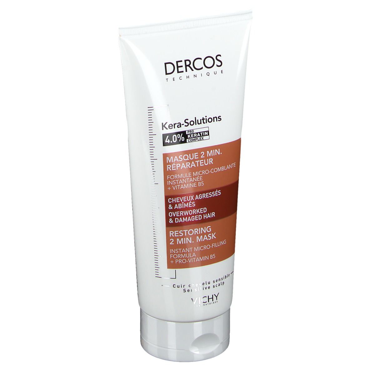 Tube blanc. Inscriptions: Dercos, Kera-Solutions, Masque 2 min. réparateur. Accents marron et rouge.