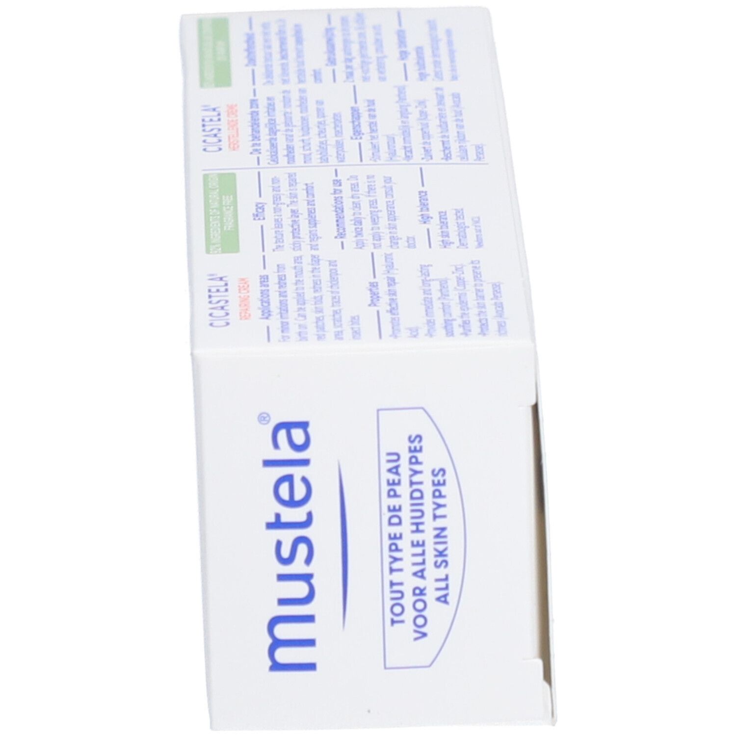 Doos met Mustela-logo en meertalige tekst. Informatie over huidtypes.