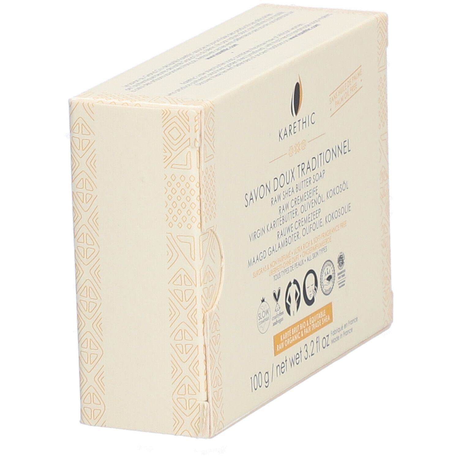 Kartonverpackung, schräg gestellt. Aufschrift: Savon Doux Traditionnel, Raw Shea Butter Soap. Logos und Zertifizierungen.