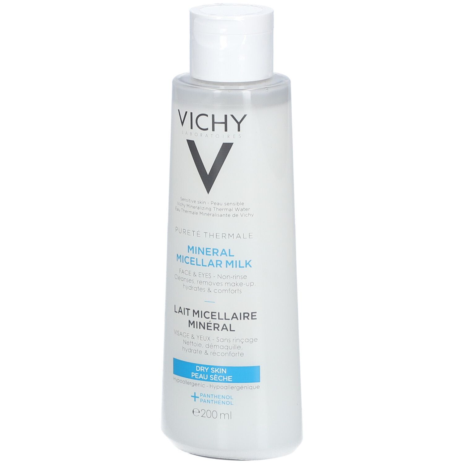Flacon blanc avec étiquette bleu et blanc. Logo Vichy et nom du produit: Lait Micellaire Minéral. Pour peaux sèches.