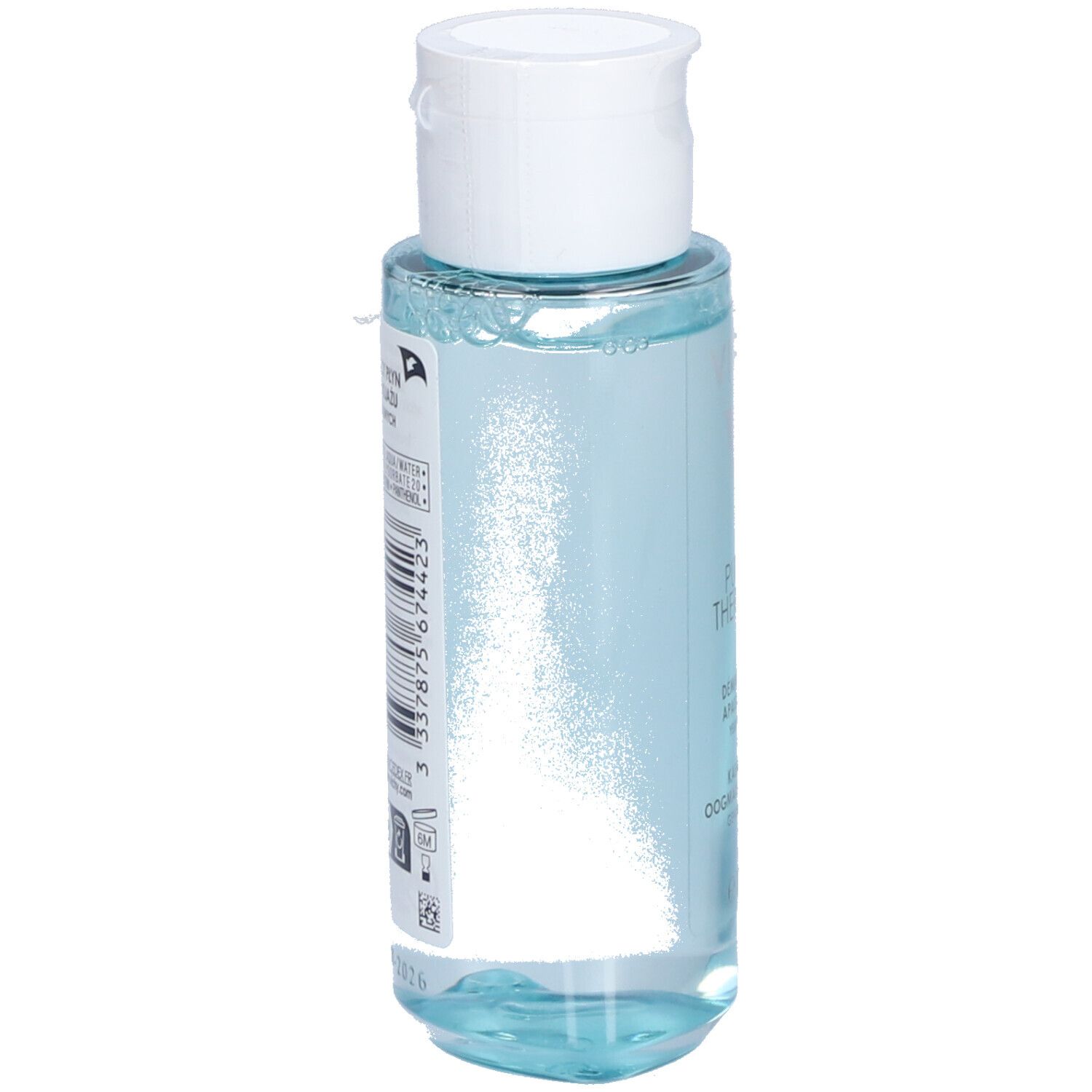 Dos du flacon Vichy Pureté Thermale. Code-barres et texte sur fond transparent. Bouchon blanc.