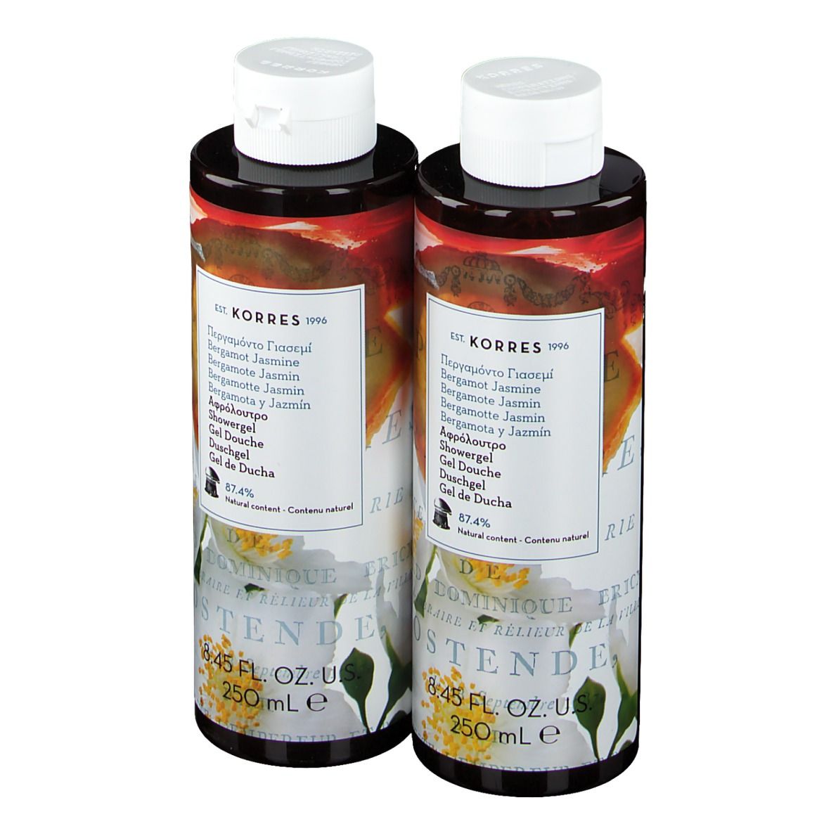 Zwei Flaschen Duschgel mit weißem Deckel. Etikett mit Produktnamen und floralem Design. 8.45 FL. OZ. US.
