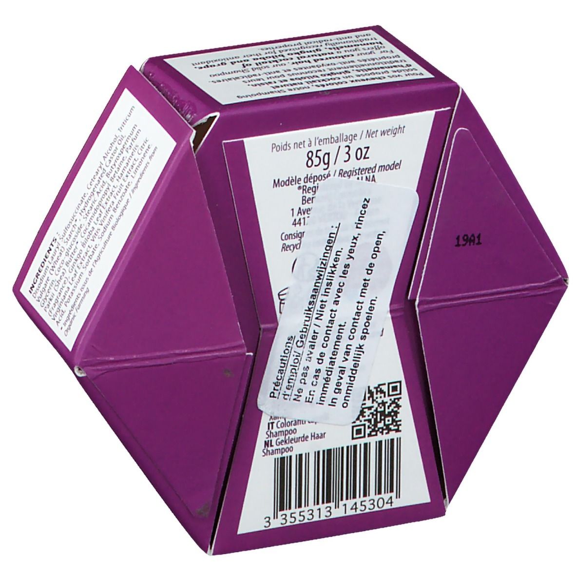 Emballage hexagonal, dos. Poids 85g/3 oz. Avertissements et code QR. Nom du produit non visible.