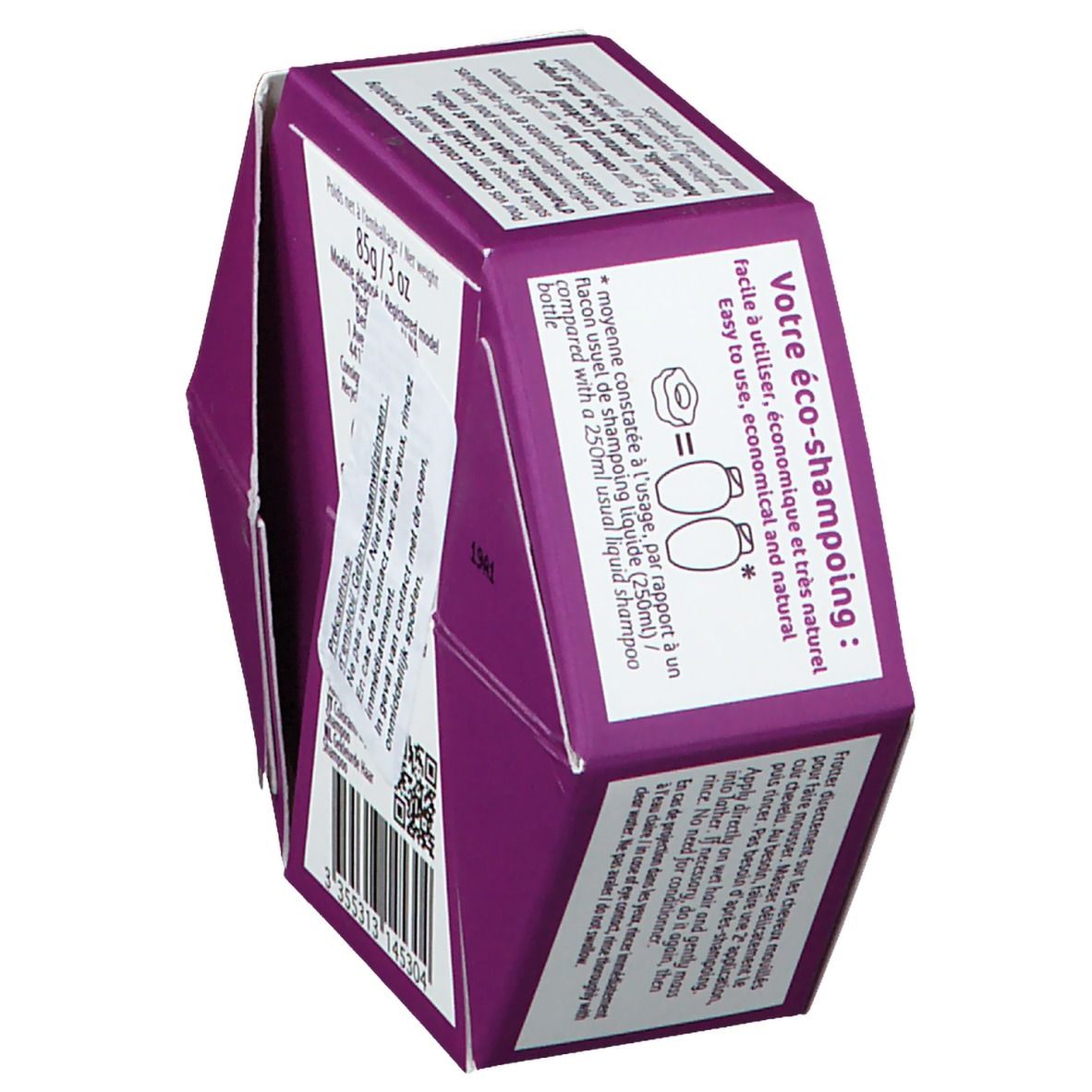 Emballage hexagonal, vue latérale. Texte : « Votre eco-shampooing ». Code QR et nom du produit non visibles.