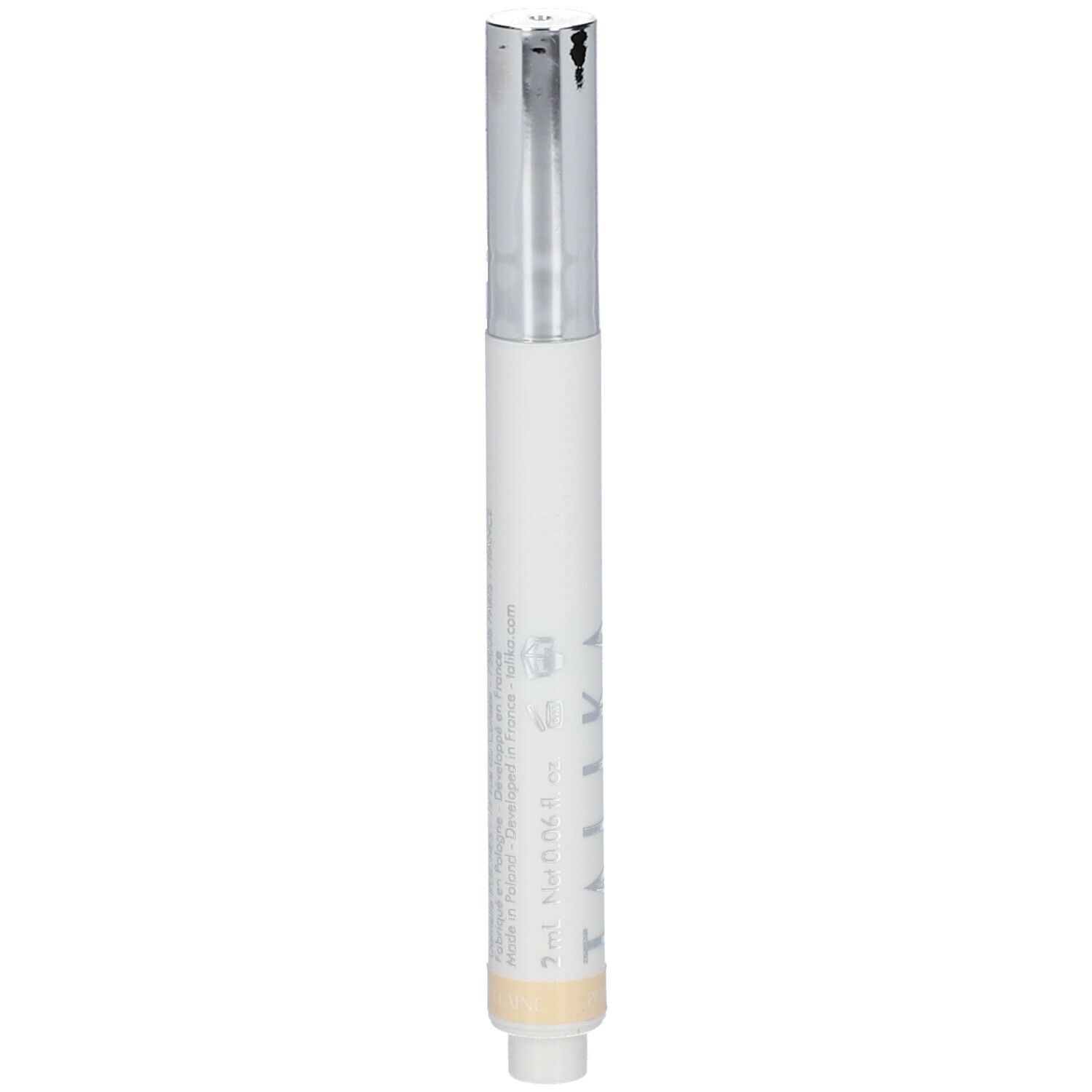 Stylo correcteur blanc avec capuchon argenté. Partie inférieure beige. Logo TALIKA visible.