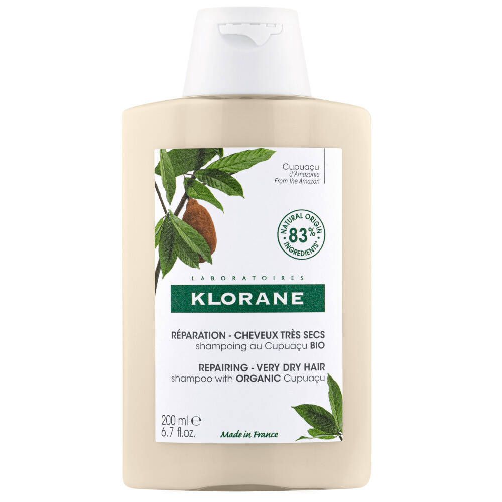 Beige shampoo fles met witte dop. Opschrift: Klorane, Reparatie voor zeer droog haar. Met Bio-Cupuacu.
