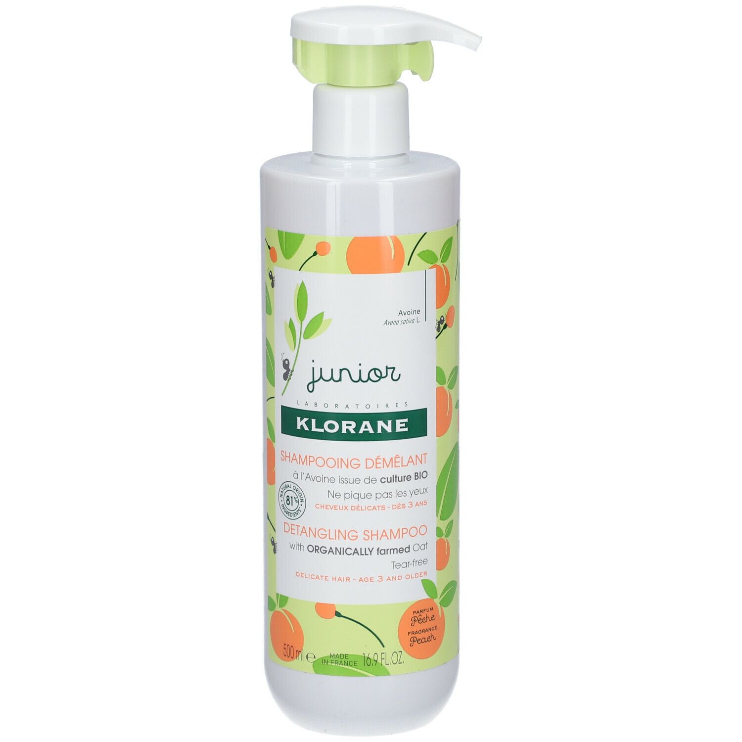 Witte fles met groene pomp. Opschrift: Klorane Junior Shampooing Démêlant, Bio Haver, Perzik. Met illustraties.