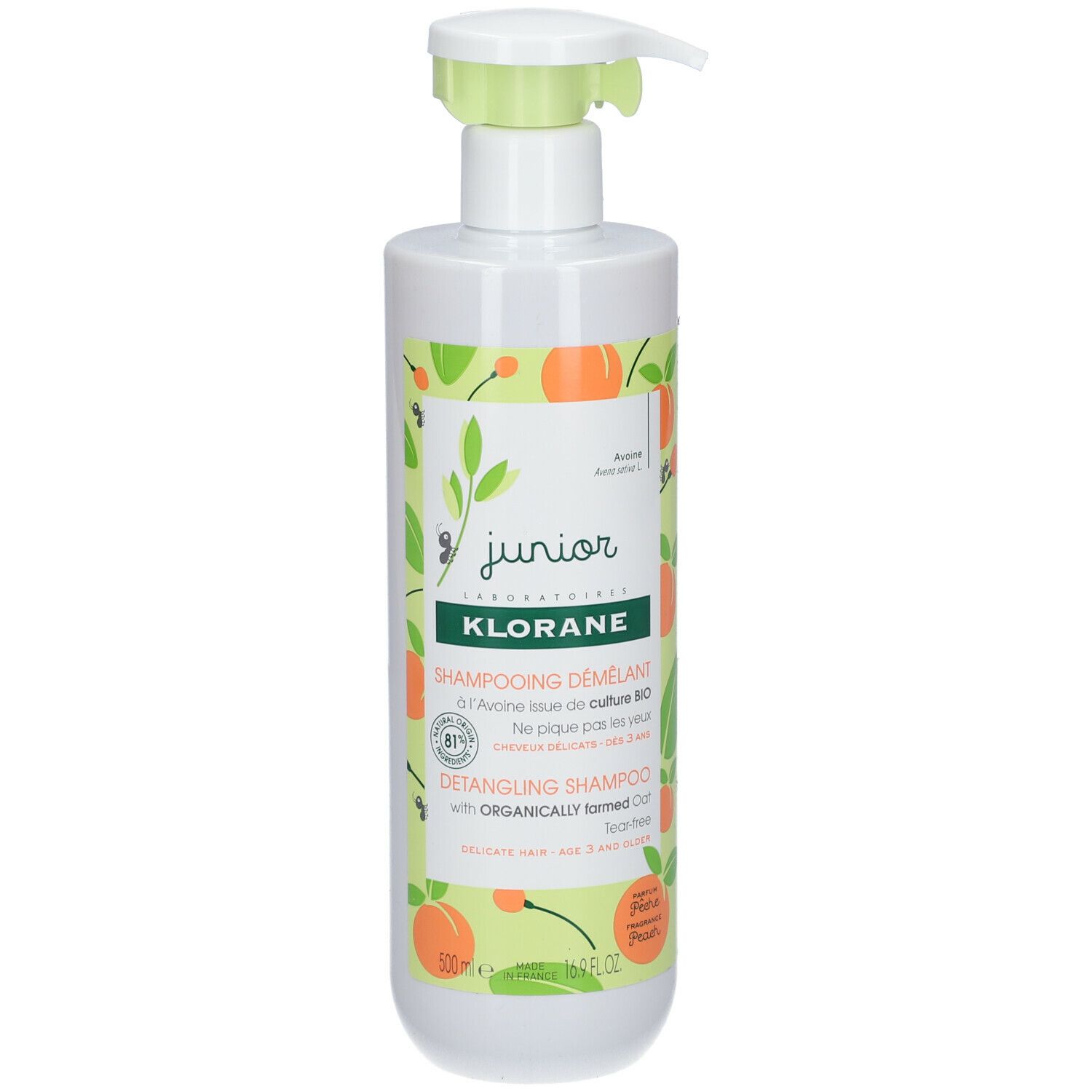 Witte fles met groene pomp. Opschrift: Klorane Junior Shampooing Démêlant, Bio Haver, Perzik. Met illustraties.