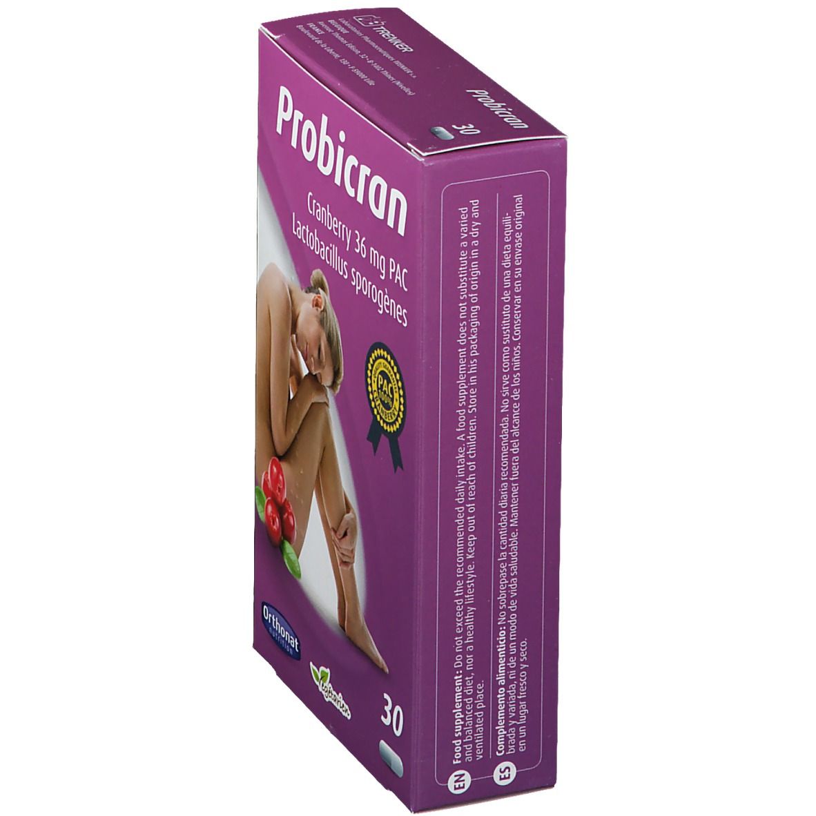 Vue en biais de la boîte Probicran. Inscription: cranberry 36 mg PAC, Lactobacillus sporogènes. Avec femme et canneberges.
