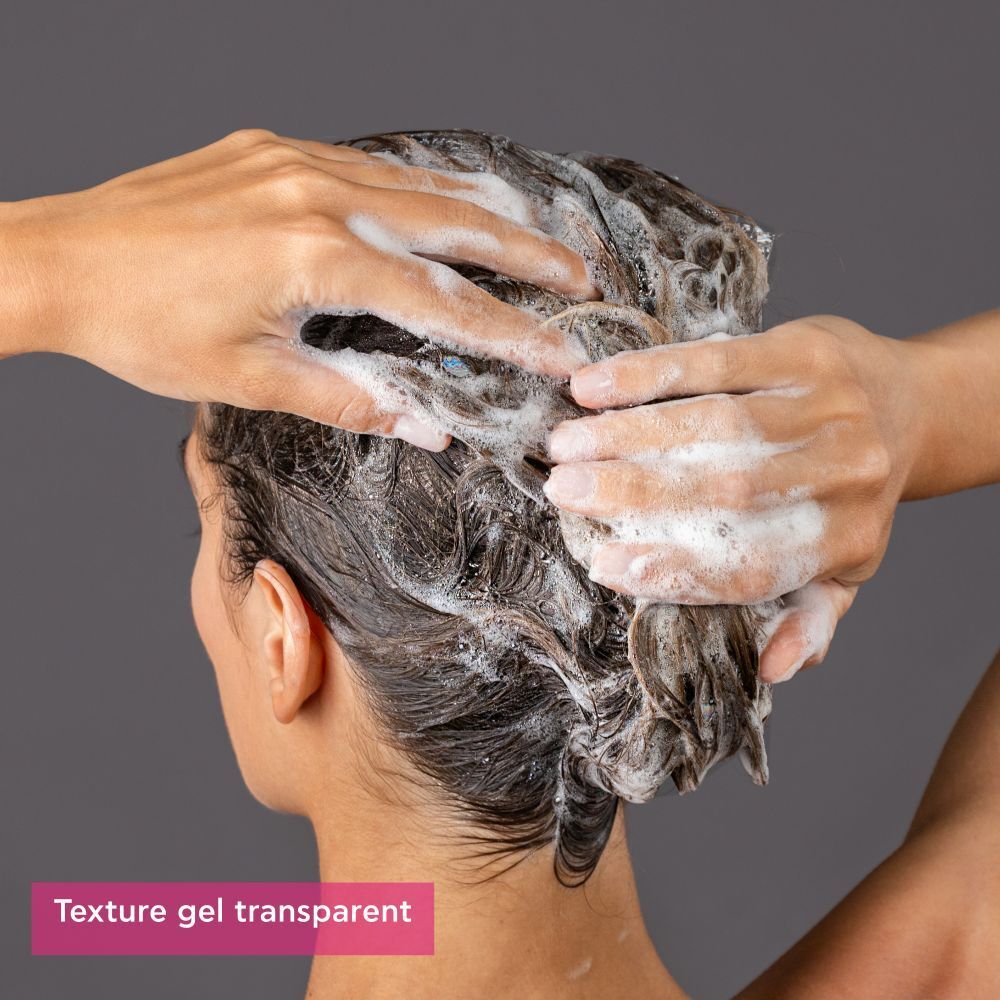 Flacon marron avec pompe noire. Inscription : Apivita Tonic Shampooing pour femmes.