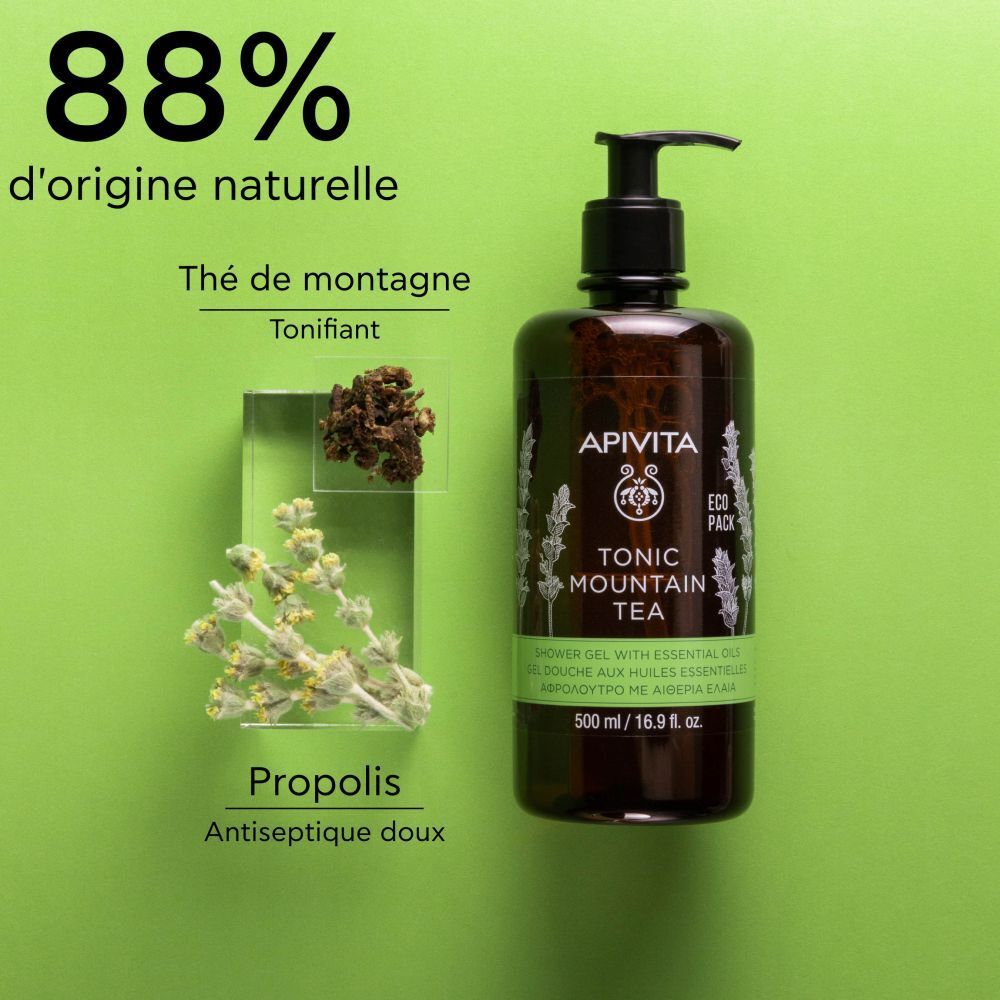 Flacon marron avec pompe noire. Inscription : APIVITA, TONIC MOUNTAIN TEA, gel douche. Étiquette verte et blanche.