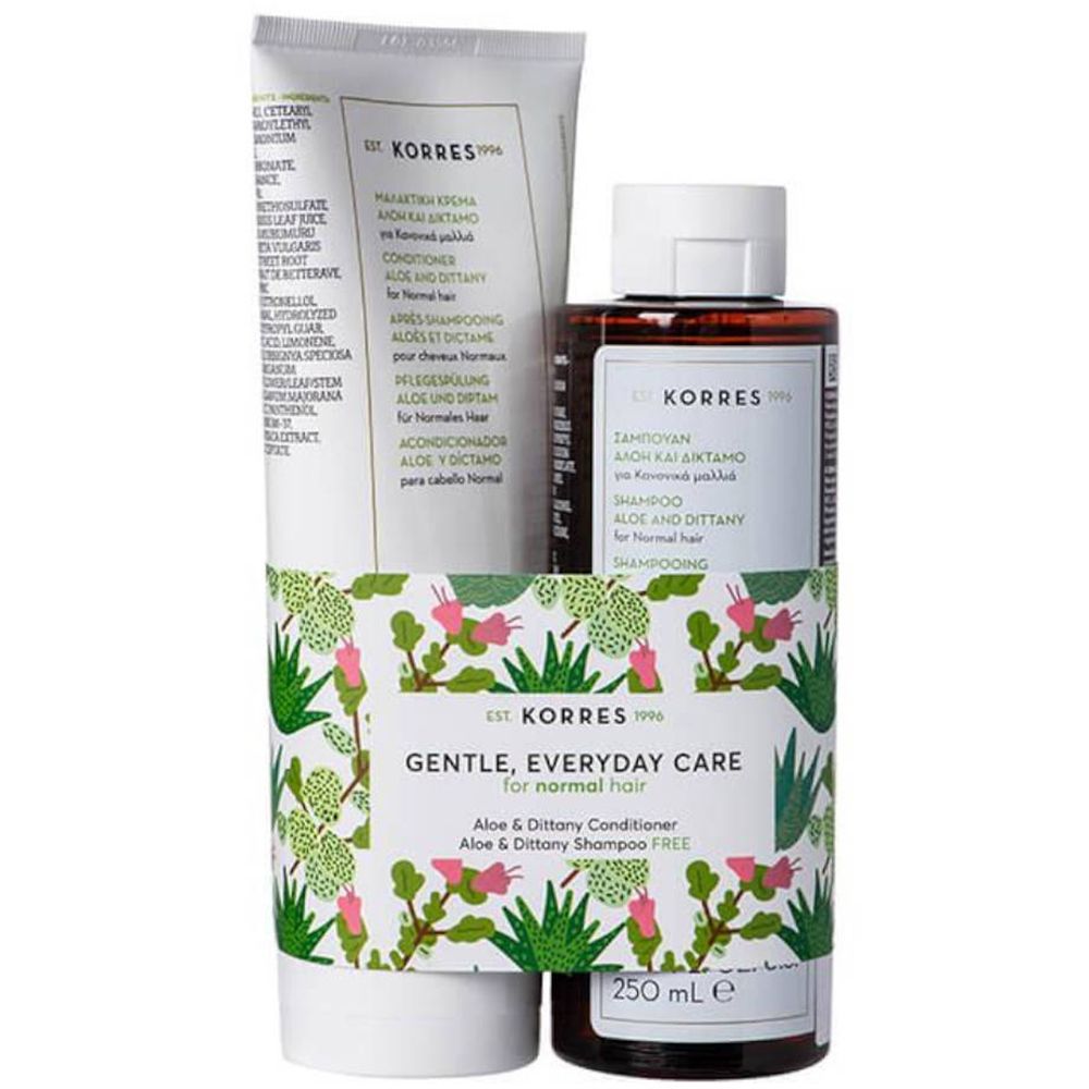 Korres Haarpflege Set. Shampoo und Conditioner in weißer Tube und brauner Flasche. Verpackung mit floralem Muster und Produktnamen.