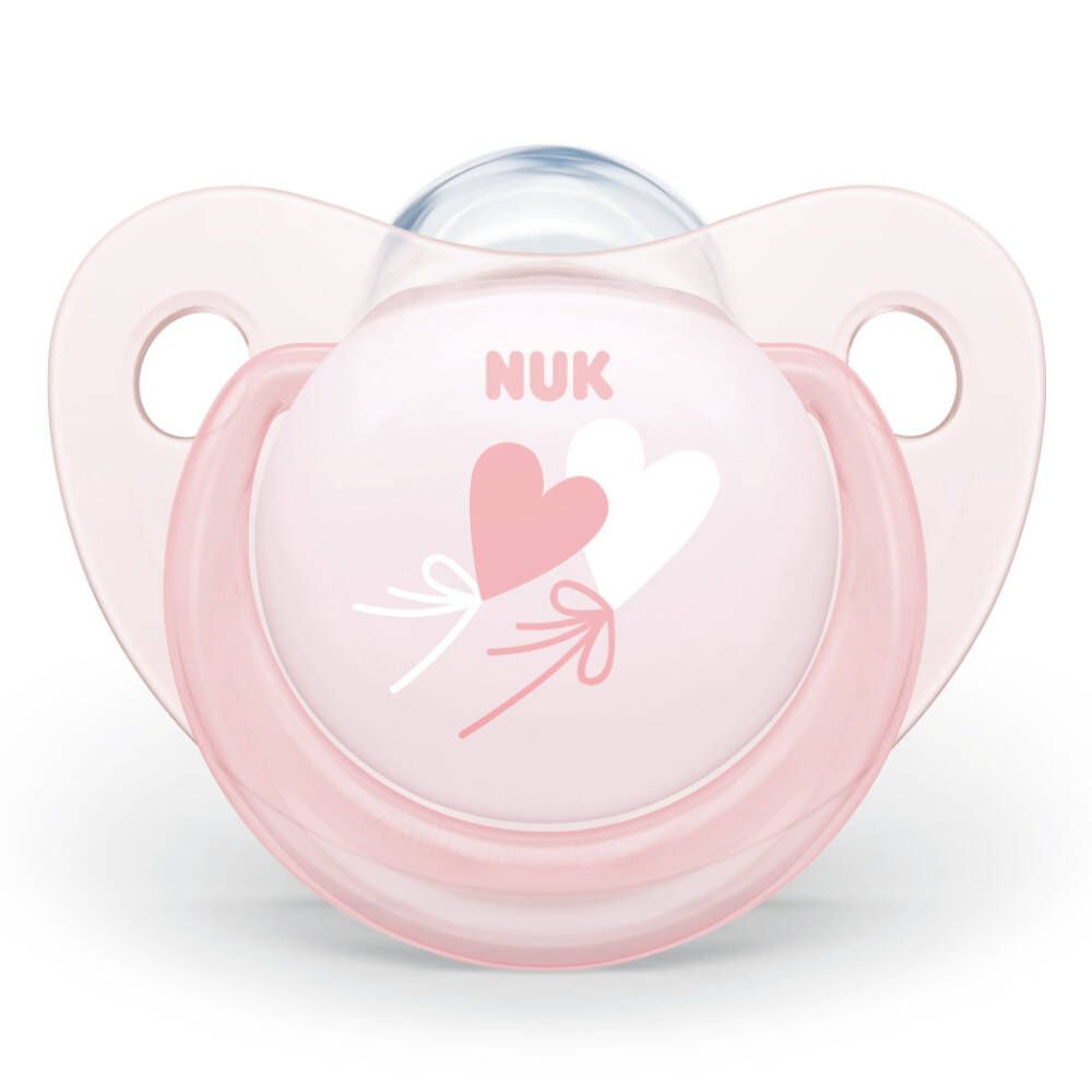 Une sucette rose avec un motif de cœur et le logo NUK.