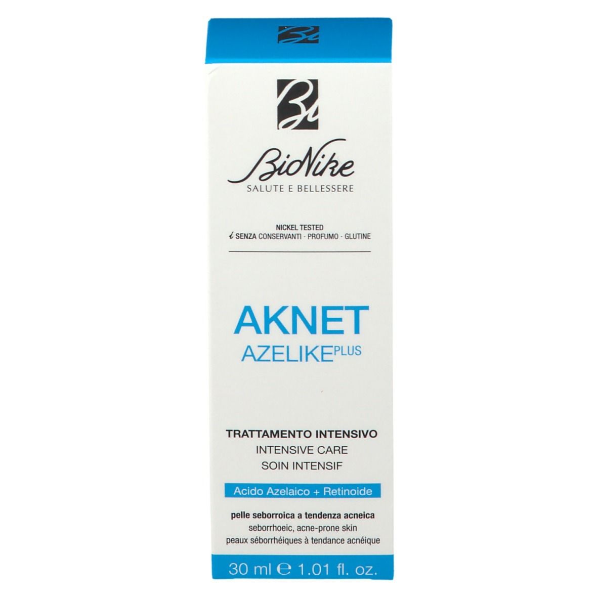 Witte doos met blauw deksel. Opschrift: AKNET AZELIKE, Bionike logo. Meertalige tekst.
