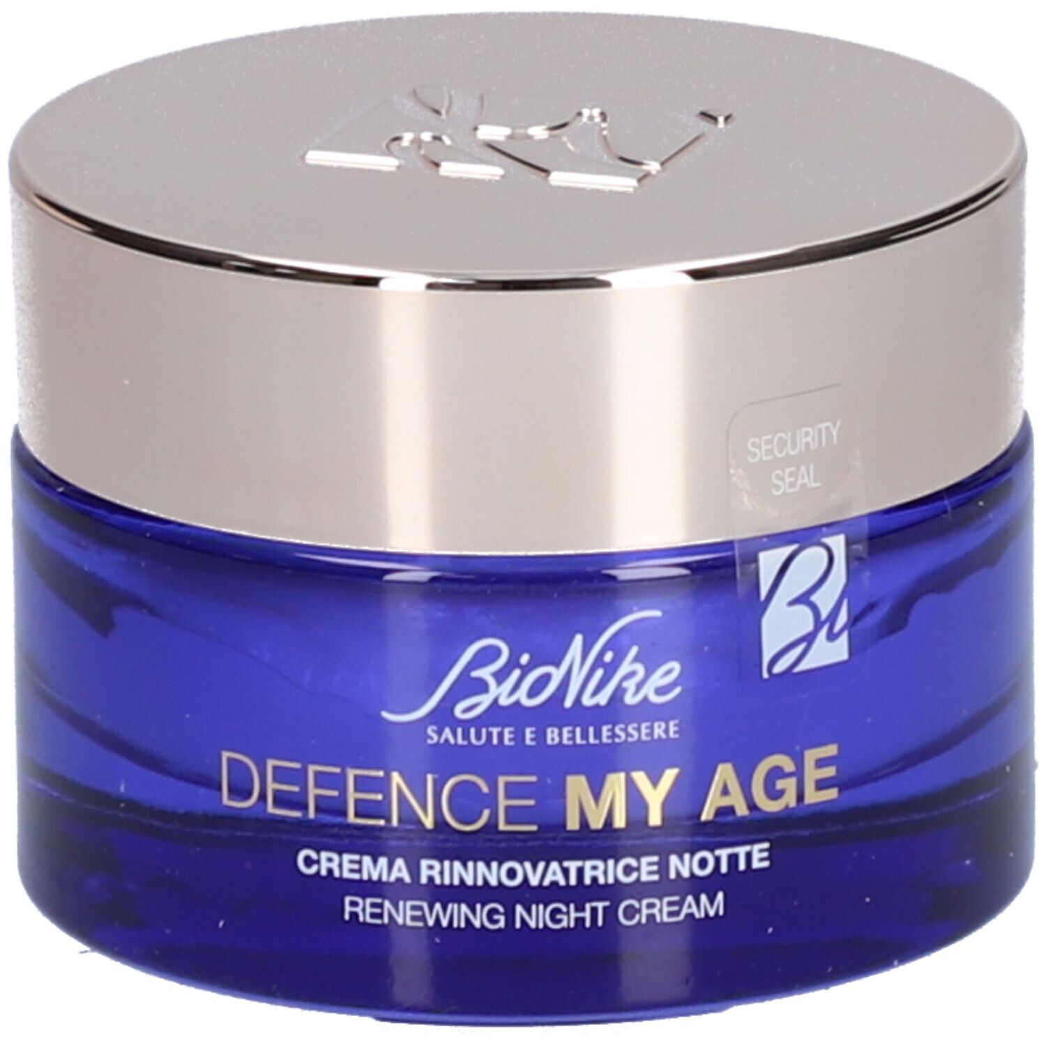 Blauwe crèmepot met zilveren deksel. Opschrift: BioNike, DEFENCE MY AGE, Creme Rinnovatrice Notte, Renewing Night Cream. Veiligheidszegel.