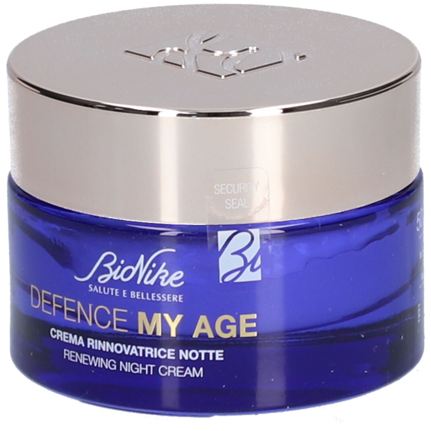 Blauwe crèmepot met zilveren deksel. Opschrift: BioNike, DEFENCE MY AGE, Creme Rinnovatrice Notte, Renewing Night Cream. Veiligheidszegel.