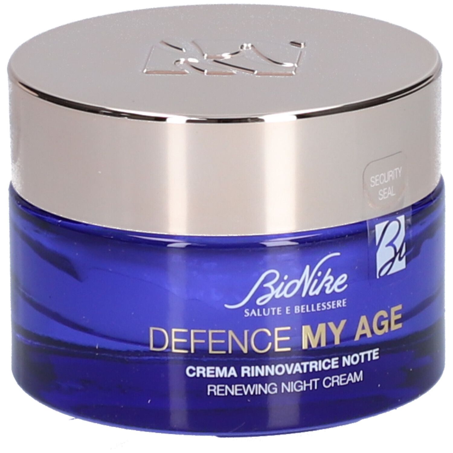 Blauwe crèmepot met zilveren deksel. Opschrift: BioNike, DEFENCE MY AGE, Creme Rinnovatrice Notte, Renewing Night Cream. Veiligheidszegel.