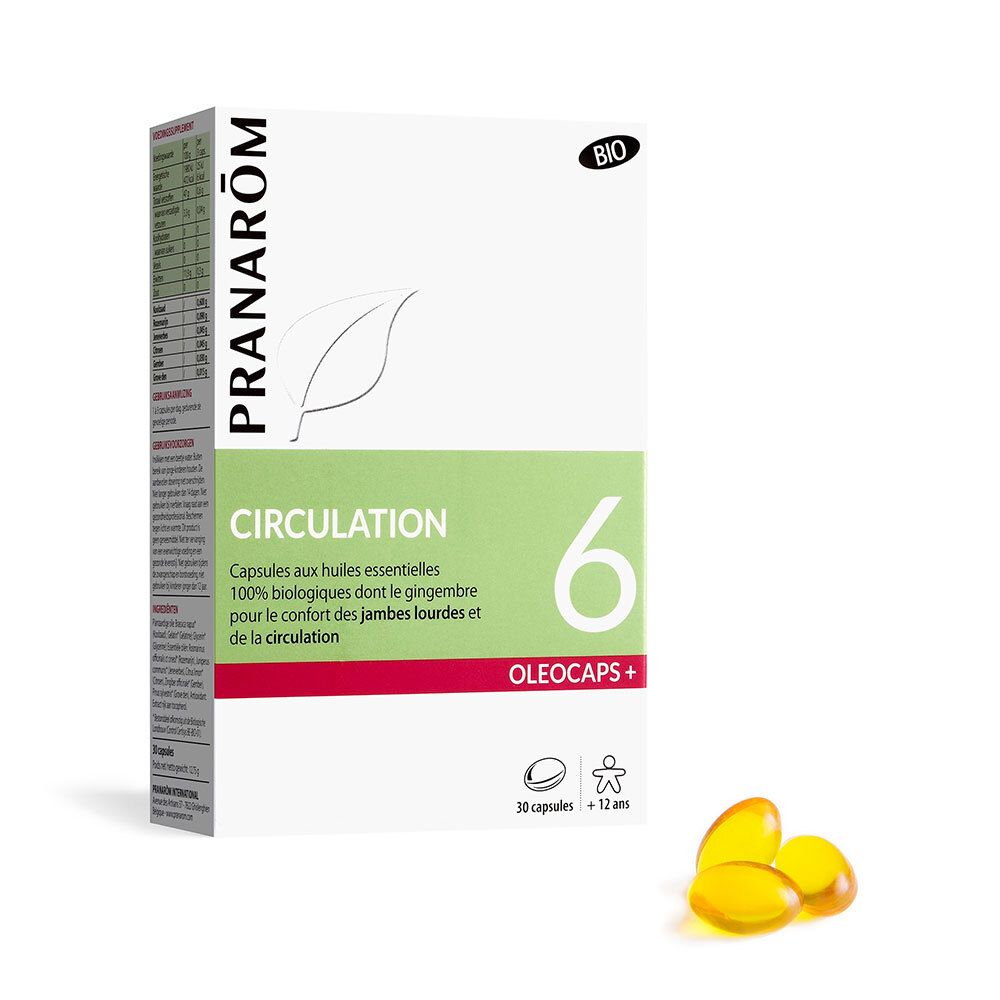 Boîte de capsules. Nom du produit, logo et label bio. Capsules transparentes à côté de l'emballage.