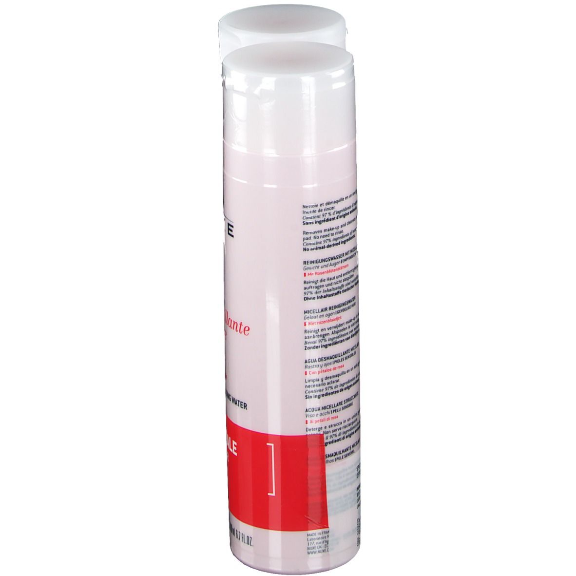 Une bouteille d'eau micellaire Nuxe, flacon rose, bouchon blanc, texte sur l'étiquette, bande rouge avec texte.