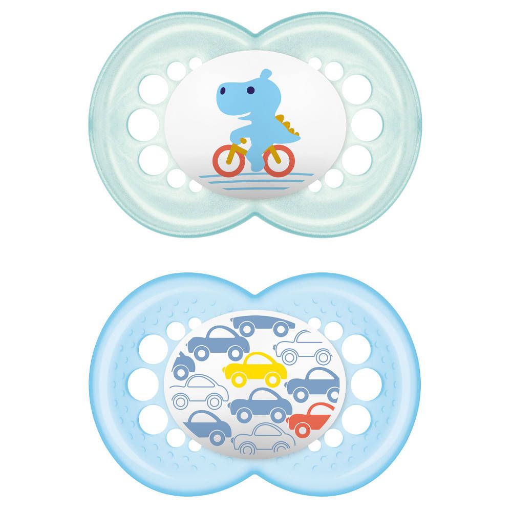 Deux sucettes avec motifs colorés : dinosaure à vélo et voitures. Vert clair et bleu clair. Forme ronde avec trous.