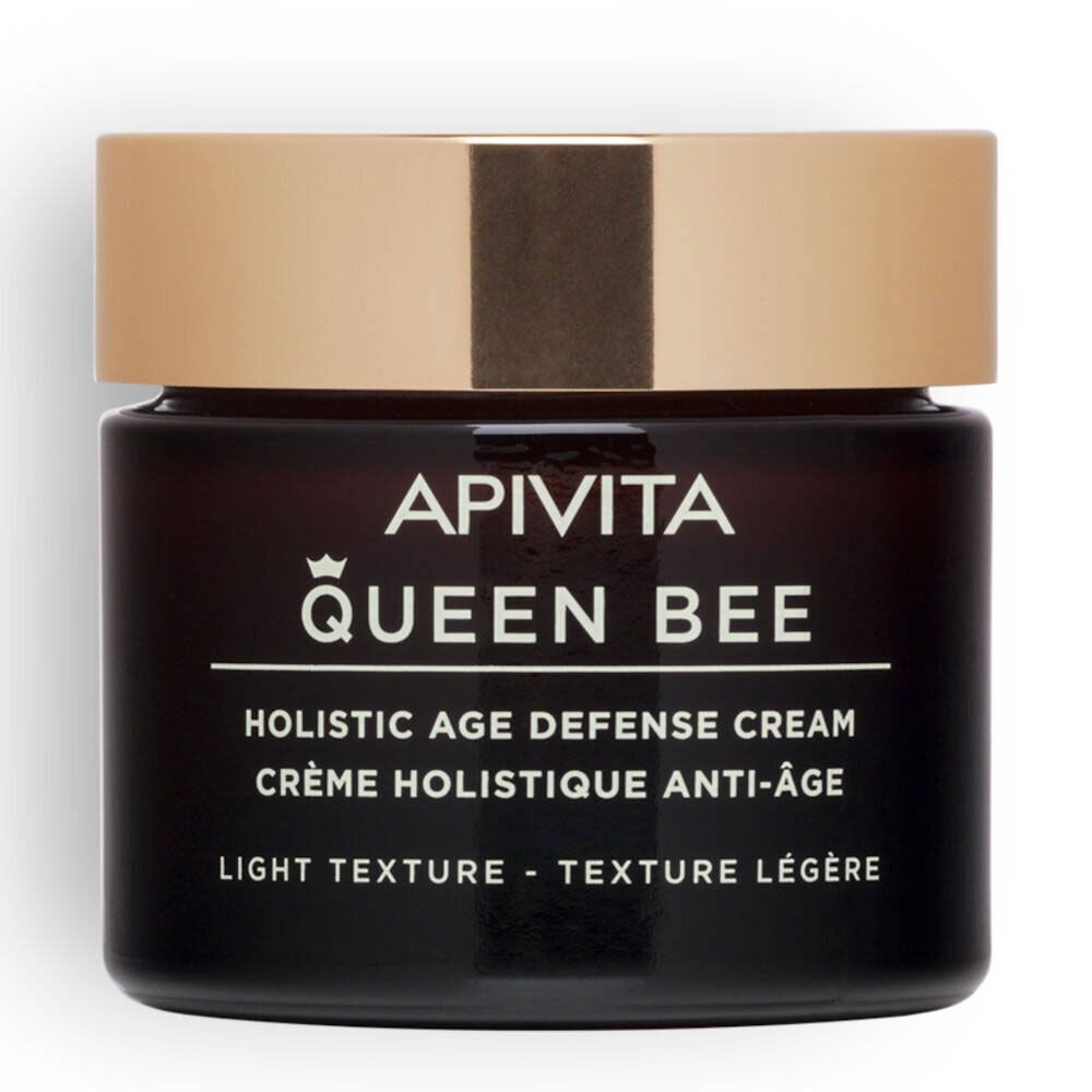 Donkere glazen pot met gouden deksel. Opschrift: APIVITA Queen Bee, Holistic Age Defense Cream, Light Texture.