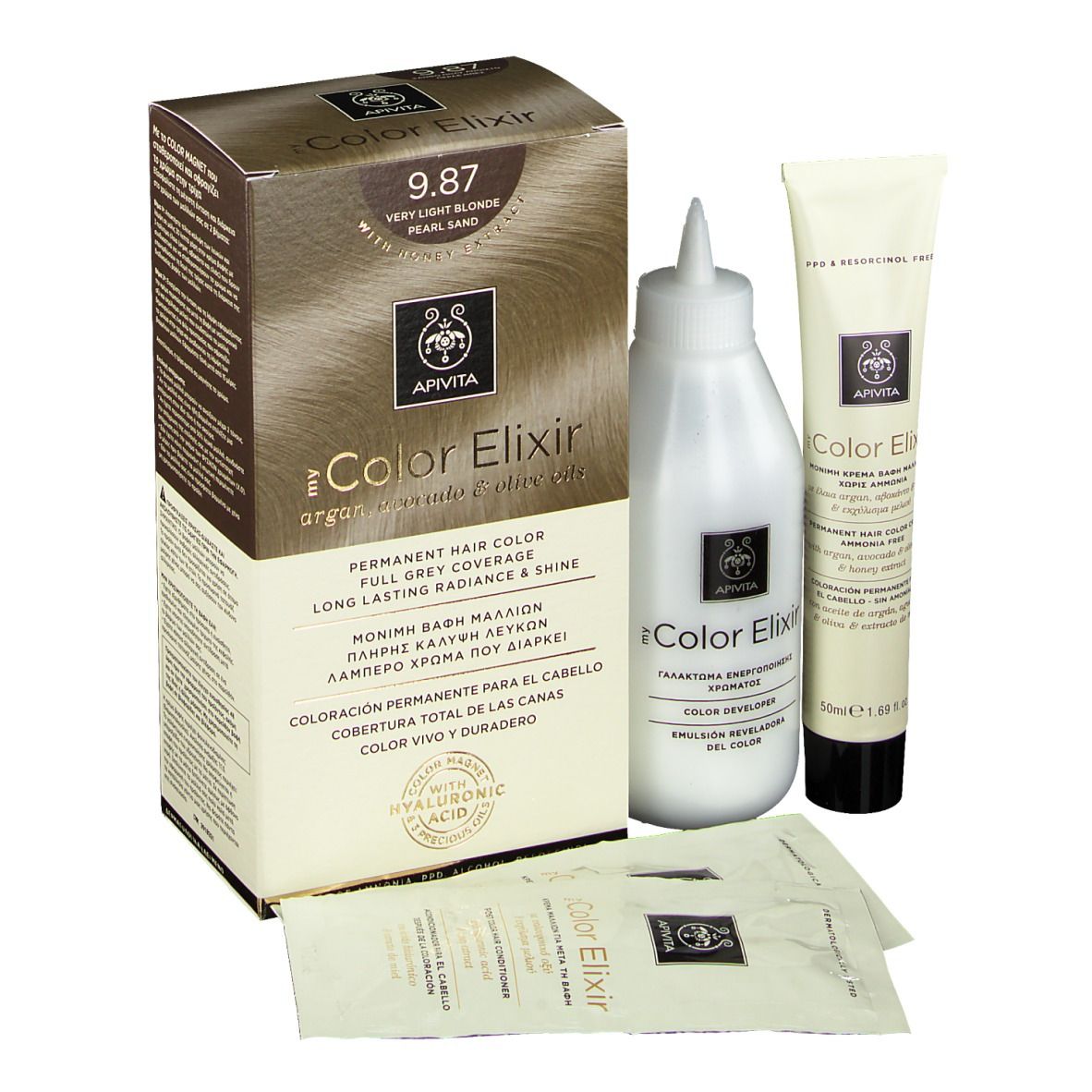 Kit de coloration capillaire. Comprend une boîte, une bouteille, un tube et deux sachets. Sur la boîte, on lit "9.87 Très blond perlé sable".
