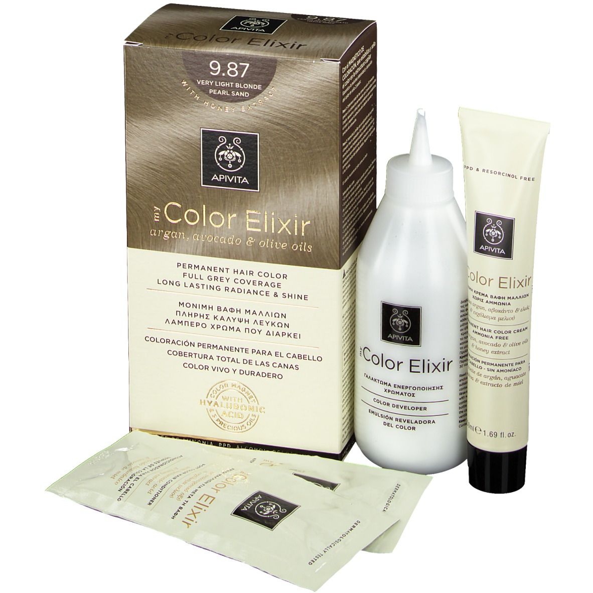 Kit de coloration capillaire. Comprend une boîte, une bouteille, un tube et deux sachets. Sur la boîte, on lit "9.87 Très blond perlé sable".