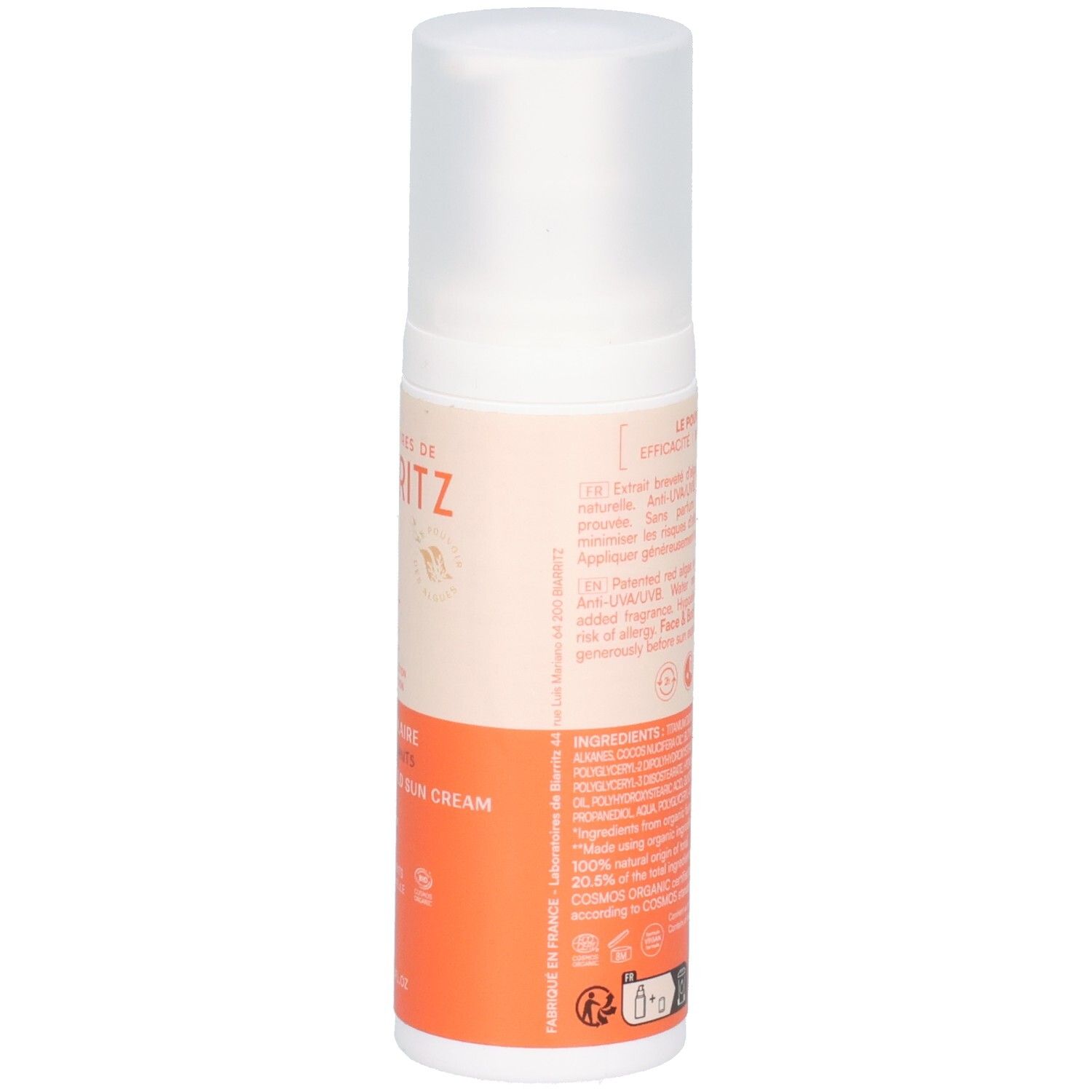 Rückseite der Sonnencreme-Flasche. Text in mehreren Sprachen. Orangefarbener und beiger Aufdruck.