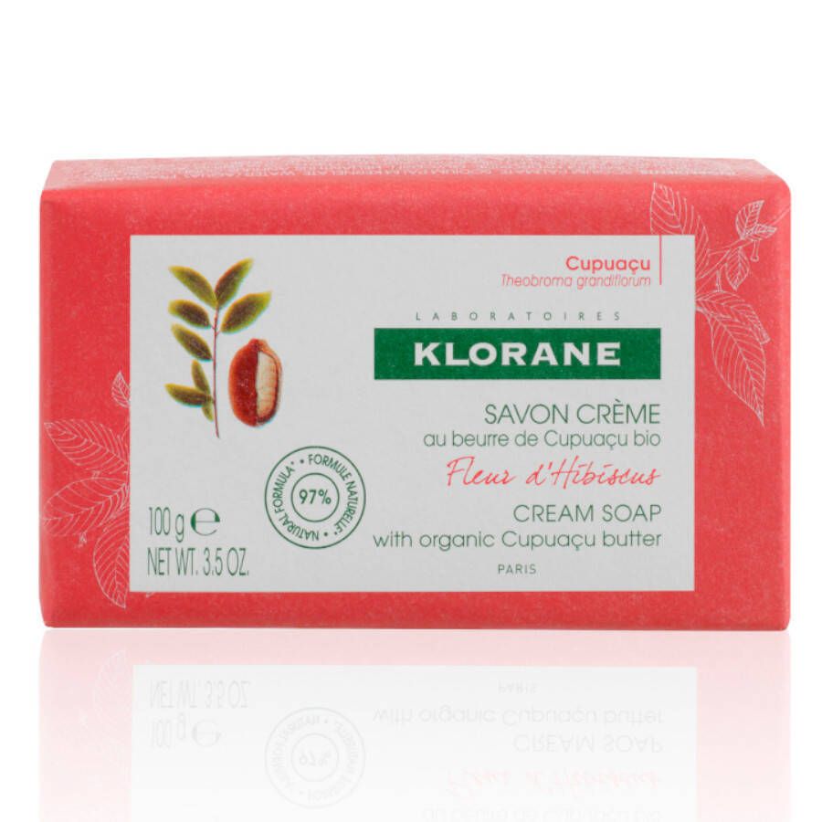 Savon KLORANE emballé en rouge. Inscriptions: Savon Crème, beurre de Cupuaçu, Fleur d'Hibiscus. 100g, formule naturelle à 97%.