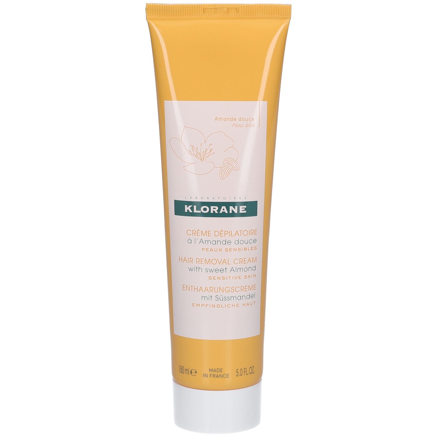 Gelbe Tube mit weißem Deckel. Aufschrift: KLORANE, Crème dépilatoire à l'Amande douce, Hair Removal Cream, Enthaarungscreme mit Süßmandel.